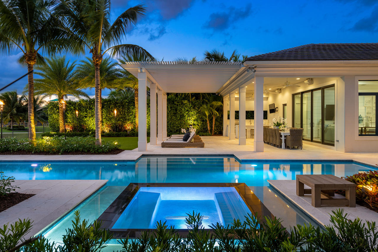 No expense was spared in upgrading this gorgeous waterfront home located in Frenchman's Harbor. From the minute you walk into the front door you have sweeping direct Intracoastal wide water views, in a no wake zone with no fixed bridges. Enjoy all that South Florida has to offer 365 days a year. Experience coastal vibes throughout your professionally decorated interior by Pineapples and Palms. This beautiful single story home was custom built by Toll Brothers in 2015 and current owner remodeled and updated with top of the line finishes throughout.  Some of the features includes engineered wood floors throughout living areas and bedrooms, ship lap features in the living room, family room and butler pantry.  Custom kitchen designed by Waterview Kitchens, appliances include a 48'' Sub Zero... refrigerator, Bosch dishwasher, 6 Burner Wolf Cooktop w/ Grill, Double oven w/  warming drawer, 2 Islands, quartz countertops and lots of storage.  Adjacent to the kitchen is a beautifully designed Butler Pantry w/ more storage, Sub Zero wine cooler & Sub Zero beverage fridge, near another large pantry. Master Bedroom features its own lanai overlooking a tranquil & relaxing Zen garden. The Landscaping and outdoor living space has been featured in numerous magazines. In addition to all this there is an oversized paver driveway with an attached 3 car air conditioned garage w/ epoxy floors and a detached air-conditioned garage. The list goes on!