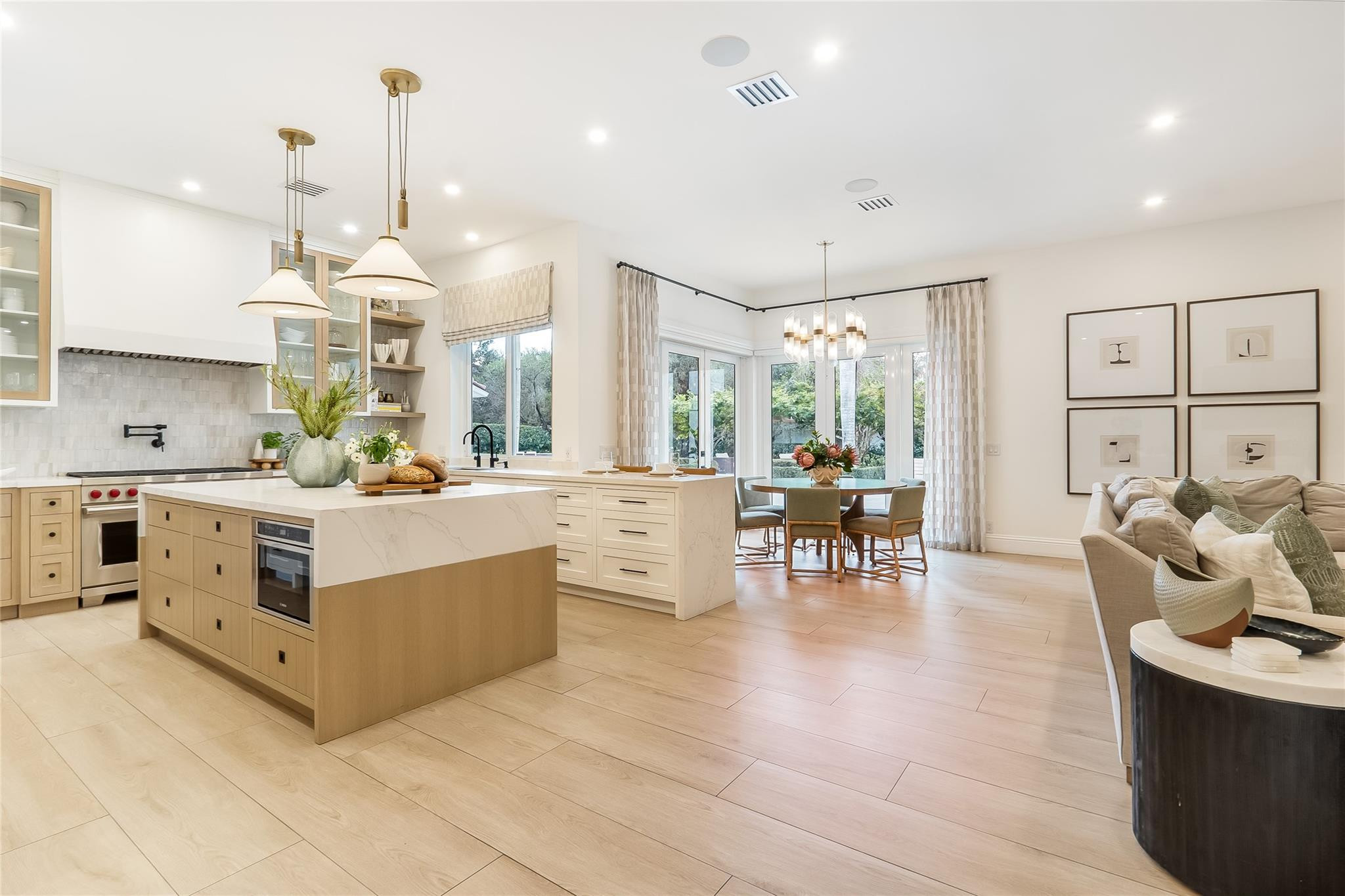 A Home Designed to Be Felt, Not Just Seen! Being sold fully furnished, Turn Key! Perfectly positioned and extensively renovated estate offers a rare combination of luxury, comfort, privacy, and modern convenience. Bathed in natural light through expansive impact windows and doors, the home showcases breathtaking views of manicured grounds and a resort-style heated saltwater pool. Every detail has been thoughtfully reimagined, from the designer lighting to the custom architectural finishes that create an atmosphere of timeless elegance. This is one of the most extraordinary opportunities in Windmill Ranch Estates. Nestled on approximately 1.37 private acres, this extensively renovated estate has been thoughtfully reimagined to deliver an unparalleled luxury lifestyle where every detail has already been considered. A grand arrival begins with an expanded brick-paver driveway, lush professional landscaping, custom impact front entry, and elegant exterior lighting. Inside, natural light pours through impact windows and doors, smooth-finish ceilings, designer lighting, custom window treatments, and beautifully reconfigured living spaces designed for both comfort and sophistication. The spectacular chef's kitchen serves as the heart of the home, featuring a Wolf 8-burner gas range, Thermador refrigerator and freezer columns, Bosch dishwasher, microwave drawer, custom cabinetry, handcrafted plaster hood, pot filler, and Zip Water system providing filtered, boiling or chilled water on demand. Designed for effortless entertaining, the family room and game room showcase custom built-ins, Samsung Frame TVs, a designer entertaining bar, Thermador refrigerator drawers, white oak architectural details, and multiple gathering spaces. The luxurious primary retreat offers custom cabinetry, designer finishes, spa-inspired dual baths with NEOREST TOTO smart toilets, steam system, custom dressing areas, and dedicated Trane climate control. Smart-home features include Control4 whole-home audio, enterprise-grade Aruba Wi-Fi, whole-house water filtration, 10-camera security system, RainBird smart irrigation, new Trane A/C systems, updated water heaters, and extensive infrastructure improvements. Outside, enjoy a heated saltwater pool, summer kitchen, guest house, upgraded outdoor living spaces, and resort-style grounds that create an atmosphere of privacy, relaxation, and effortless luxury. Rarely does a home combine this level of design, craftsmanship, technology, and lifestyle. This is more than a residence, it is one of Weston's most compelling luxury estates.