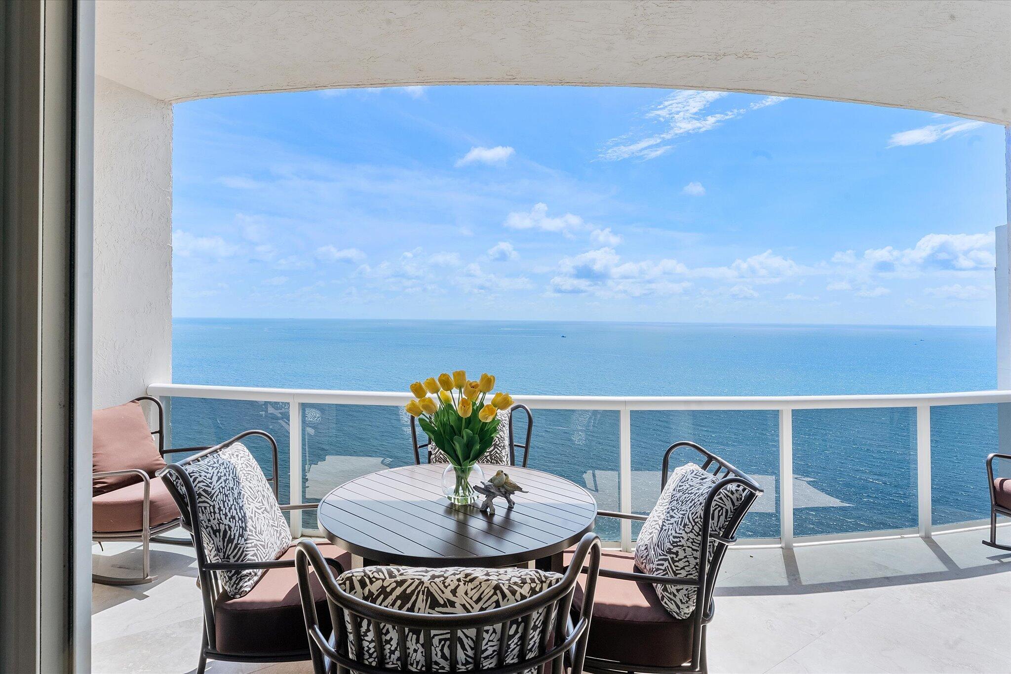 DIRECT OCEAN UPPER PENTHOUSE w/ 11 FOOT CEILINGS at L'Hermitage Tower 2 - breathtaking, unobstructed views of Ocean and Intracoastal Waterway on 2 balconies. Over 2,100SF open, elegant living space, custom built-ins/marble flooring—inside and out. The third bedroom is integrated with open kitchen. 3 FULL BATHS. L'Hermitage is over 10 acres of resort-style beachfront property and offers unparalleled amenities, including: 2.5-acre elevated pool deck with swimming pools, hot tubs, a kiddie pool, and a full-service oceanfront restaurant/Lush landscaping, shaded lounge areas, expansive green spaces/Full valet service with optional self-parking/concierge/gated entry/on-site security/tennis courts/fitness centers, his/her steam rooms, saunas, and private massage rooms, dog-walking areas and more
