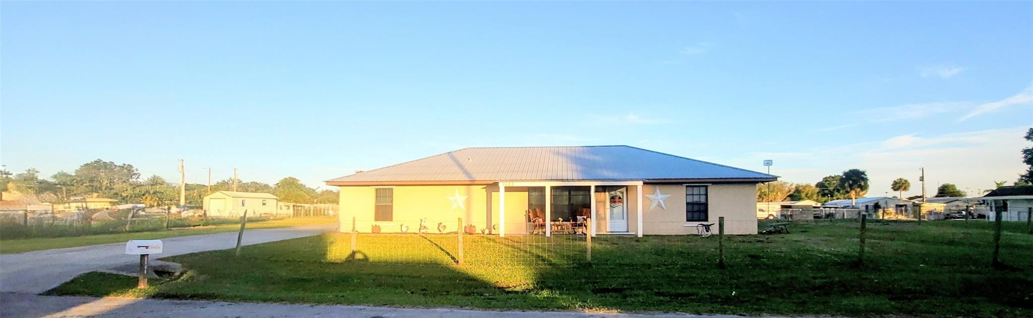 Welcome to this Beautiful and spacious 4 bedroom, 2 bath home in the heart of Lakeport. This well-kept property features attractive tile flooring throughout, a large open kitchen perfect for cooking and entertaining, and roomy walk-in closets for excellent storage. The primary suite offers a relaxing jetted jacuzzi tub, creating the perfect place to unwind. Enjoy Florida living on the screened-in back porch—ideal for BBQs, gatherings, or quiet evenings outside. Move-in ready and full of charm, this home offers comfort, space, and style in a peaceful setting. Minutes from the nearest boat ramp, with room to park your boat & RV. This property is also less than 10 miles to the new Brighton Bay casino. Please contact listing agent for your private showing!