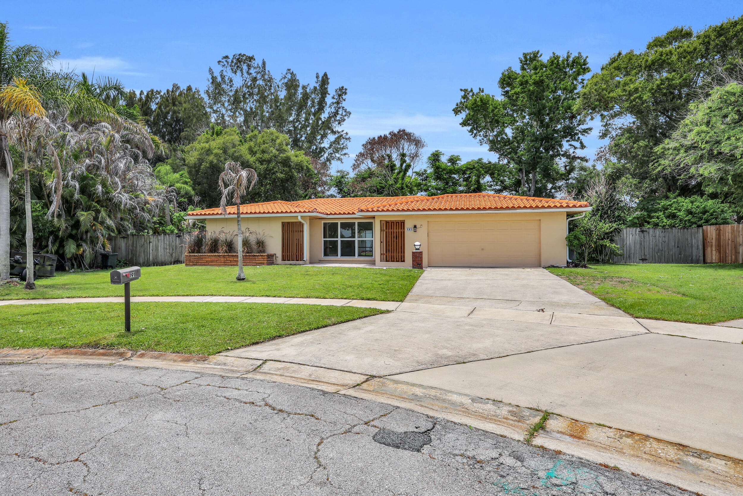 Welcome to this well-maintained CBS home situated on a spacious .41-acre, fully fenced lot in the heart of Port Saint Lucie! This 2-bedroom, 2-bath home features updated bathrooms and an updated kitchen with soft-close cabinetry and new appliances. Conveniently located close to shopping, restaurants, and everyday amenities. Major updates include a 2024 A/C, a 2021 water heater, and a 2001 clay tile roof that has been inspected and has 8 years of remaining useful life. Enjoy the freedom of NO HOA, with plenty of room to bring your boats, RVs, and toys—no restrictions. The backyard features a variety of mature fruit trees, flowering plants, and two storage sheds, offering plenty of space for gardening, entertaining, or simply enjoying the outdoors. Don't miss this opportunity!