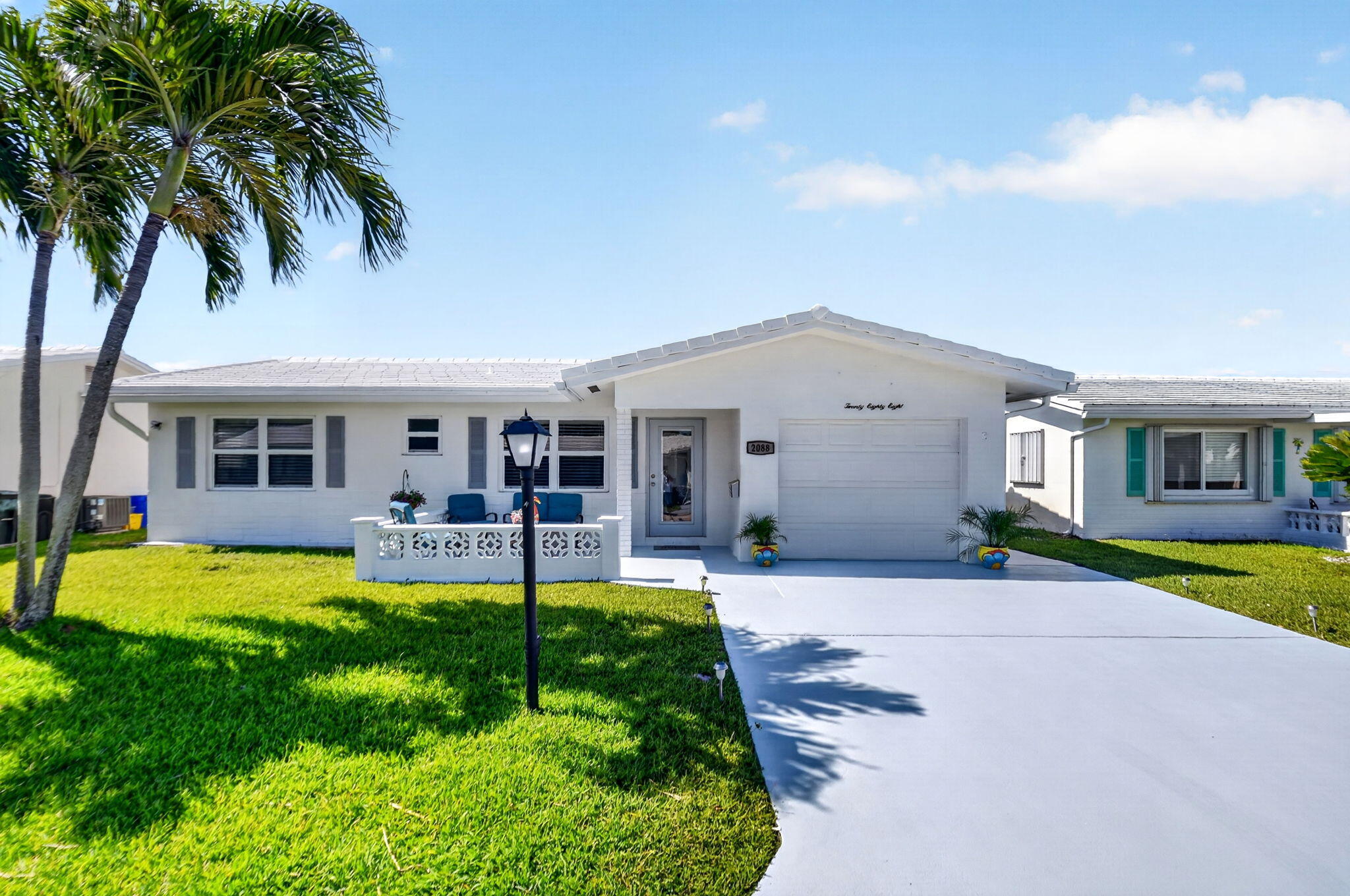 Welcome Home to this stunning totally redone turnkey 2/2 home in this vibrant active 55+ plus community with one of the lowest HOA's in Boynton Beach (187.00 monthly) includes lawn care, sprinklers, maintenance, every 5 years exterior house painting,   Free private 18 hole golf course, 3 active clubhouses each with heated pools, fitness centers,BBQ areas, shuffleboard, cornhole, bocce, and clubs & social activities. Home has designer chair rail throughout living room, dinning area and family room. Hurricane Impact  windows throughout.  Blinds on all windows as well.  Kitchen has all Black Stainless appliances and Glass cabinetry with lights and under counter lighting as well. Quartz countertops. Brand new waterproof Grey LVP throughout home.  Knockdown walls & ceiling (no popcorn).  Extra large master shower with shower seat and grab bars. Both bedrooms have walk in closets as well. Outside the back french doors  enjoy your brick paver patio.  BRAND NEW ROOF COMPLETED JAN 2026. Did I mention crown molding throughout and designer ceilings in dining area and bedrooms for added character. Laundry in garage with utility sink and epoxy flooring in garage.  Walk to Clubhouse #3. Close to all major highways, restaurants, beaches, houses of worship & shopping galore. 10 minutes to famous Atlantic Ave Delray Beach!! Lease has been paid in Full. Schedule your appointment today as this one is truly a Gem !!! Will consider a annual rental