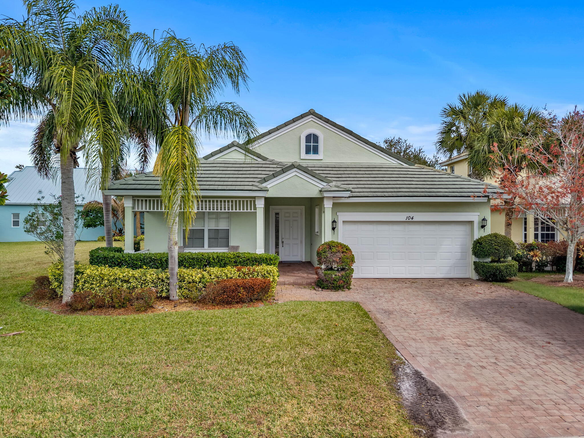 Beautifully renovated 3-bedroom, 2-bath home with a 2-car garage, ideally situated on a corner lot with tranquil lake views. This home was completely remodeled in 2015, including walls, electrical, plumbing, kitchen, bathrooms--everything has been thoughtfully updated. The bright, open kitchen features white cabinetry, granite countertops, and a clean, modern design perfect for everyday living and entertaining. The spacious primary suite offers two closets and a well-appointed bathroom with separate shower and soaking tub. Enjoy both formal living and family rooms, with the family room featuring a wall-mounted large flat-screen TV. Outdoor living is enhanced by two screened patios overlooking the lake, providing peaceful water views and ideal spaces to relax.  Conveniently located near the main gate and resort-style clubhouse, residents enjoy exceptional amenities including adult and children's swimming pools, tennis courts, basketball court, bocce ball, fitness center, billiards, library with WiFi, game room, and more.  HOA fees include internet, cable, lawn care, irrigation, pest control, gated security, and additional community services.  Come enjoy the lifestyle you deserve in this move-in-ready lakefront home.