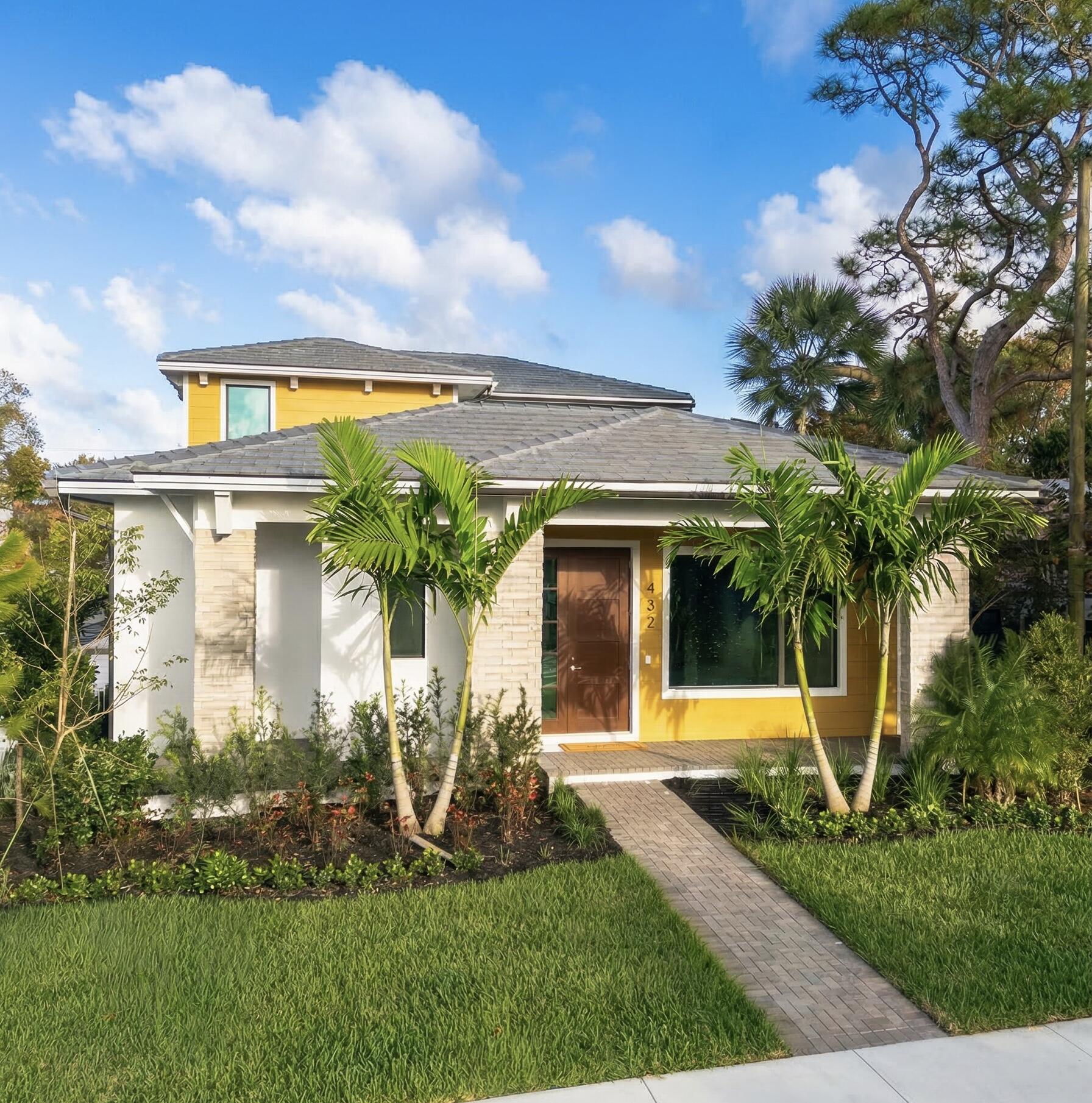 Move-in Ready | New Construction | No HOA | New, move-in ready, and loaded with thoughtful details, The Bayshore Home offers new construction without the wait or the hassle of remodeling in Stuart, Florida.  Just a short distance from the Saint Lucie River in an established neighborhood, this courtyard-style residence features four bedrooms and four-and-a-half baths arranged to balance open gathering areas with private retreats. The main-level owner's suite allows for convenient single-story living within the two-story floor plan and opens directly to a private courtyard that extends the living space outdoors. Its bath includes a freestanding soaking tub, separate shower, accent tile, Cambria quartz countertops, and a custom built-in closet system designed for everyday use. At the heart of the home, the kitchen is equipped with a full GE Café appliance suite, including a 36-inch induction cooktop with ventilation hood, double wall ovens, a wine chiller, a built-in microwave drawer, and a stainless farmhouse sink with a Moen pull-down faucet set in a generous quartz-topped island. Three sets of 10-foot sliding glass doors connect the living room, dining area, and owner's suite to the central courtyard, creating an easy indoor-outdoor flow and bringing in natural light. From the dining room, French doors open onto a side porch with a partial water view, and a covered front porch provides another comfortable outdoor sitting area for relaxing or greeting guests.  Upstairs, a spacious loft provides flexible space for work, relaxation, or hobbies, along with three additional bedrooms and their accompanying baths. Wood flooring extends through the great room, kitchen, dining room, owner's suite, stairs, and loft, while impact windows and doors enhance durability and peace of mind. The laundry room includes a GE front-load washer and dryer with a steam feature and a utility sink, and the oversized two-car garage has durable epoxy flooring and high ceilings for additional storage opportunities. Premium Kichler lighting, professional landscaping, and an irrigation system complete the home.  The Bayshore Home is located near the newly updated Oleander Park and close to the Saint Lucie River, with downtown Stuart's dining, shopping, and recreation just a short drive away. There are no HOA fees or related restrictions. Some listing photos have been virtually staged with digital furniture and décor to help illustrate how the spaces may be furnished; these images do not represent the property's current condition, and original unstaged photos are available upon request.