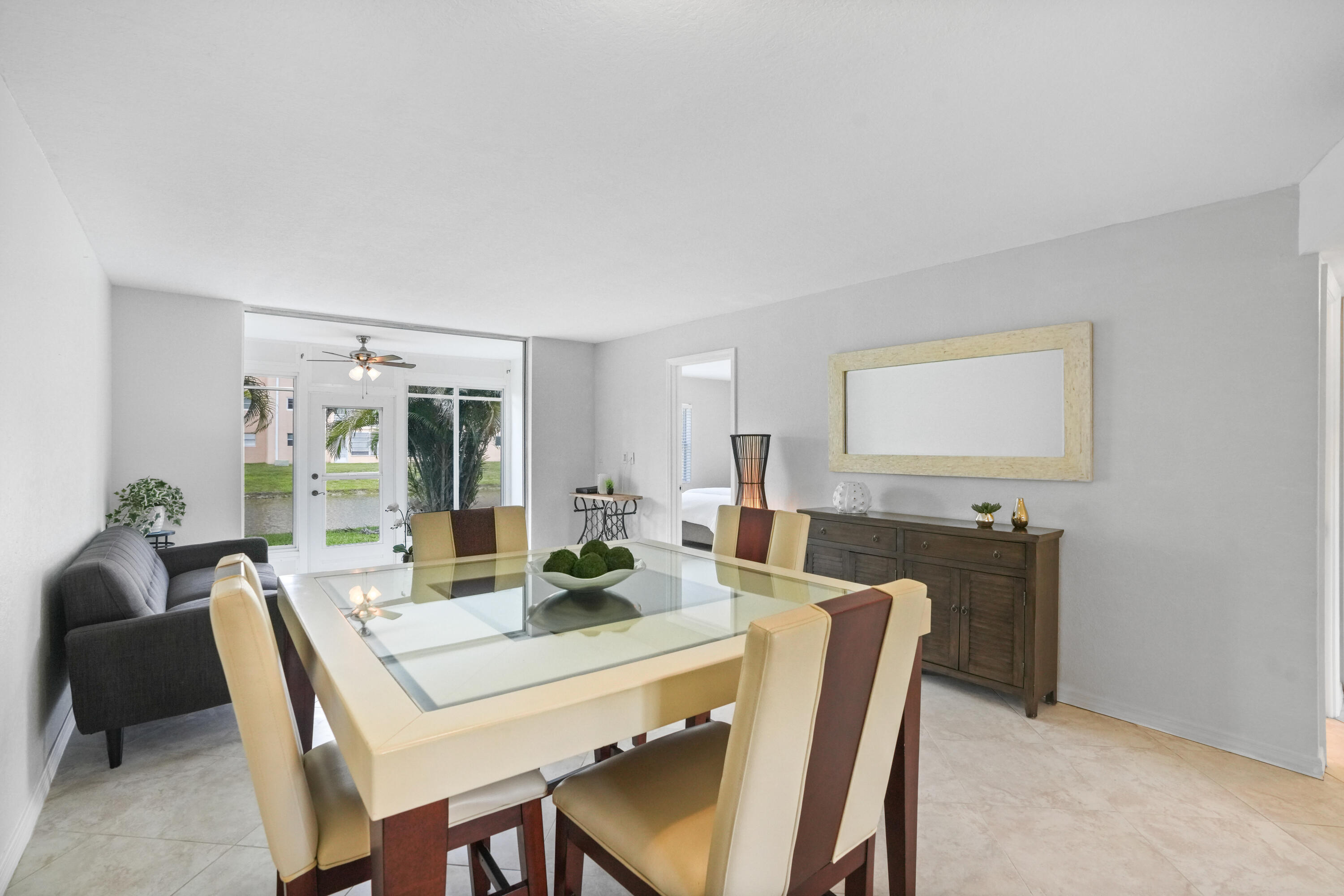 Price Improvement! Beautifully remodeled first-floor corner unit in the desirable 55+ Sunrise Lakes community. Bright and spacious floor plan featuring granite countertops and abundant natural light. This 2-bedroom residence offers walk-in closets, a new A/C system, and assigned parking conveniently located directly in front of the unit. Enjoy peaceful water views and access to community amenities, including a pool, clubhouse, fitness center, golf course, and social activities. Conveniently located near shopping, dining, and major roadways. Move-in ready and easy to show.