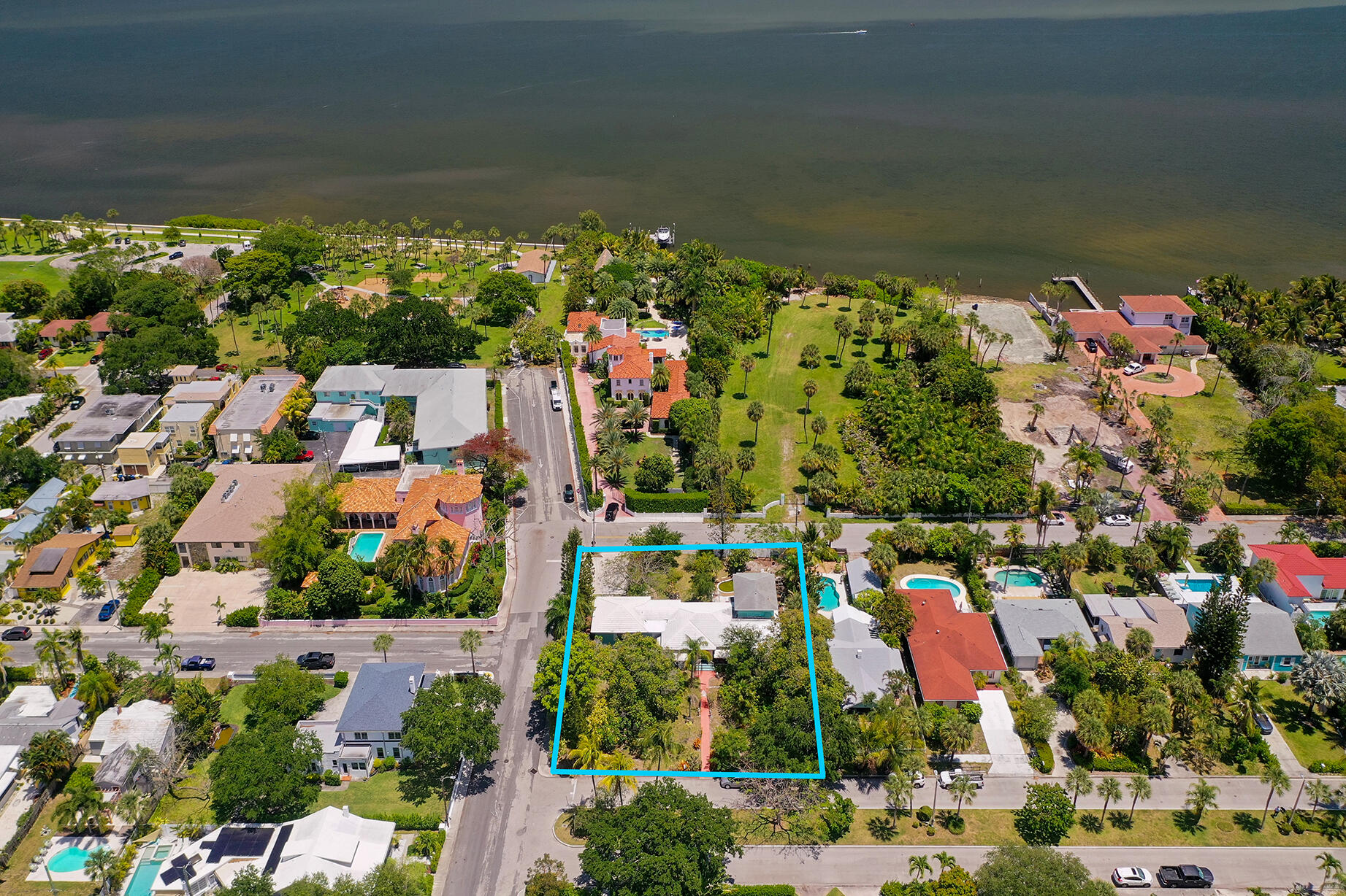 An exceptional opportunity to build an estate on this expansive 121 x 150 corner lot. Ideally positioned with the Intracoastal Waterway just across the street, this premier parcel offers an unparalleled setting for luxury coastal living. Surrounded by multimillion-dollar homes, the property's generous size is perfect for a grand residence with a private outdoor oasis and resort-style amenities. Located just minutes from Palm Beach Island and Downtown West Palm Beach, with pristine beaches nearby, this location offers both exclusivity and convenience. Existing structure is original and being sold as-is. Tenant-occupied month-to-month; do not disturb. No interior access.
