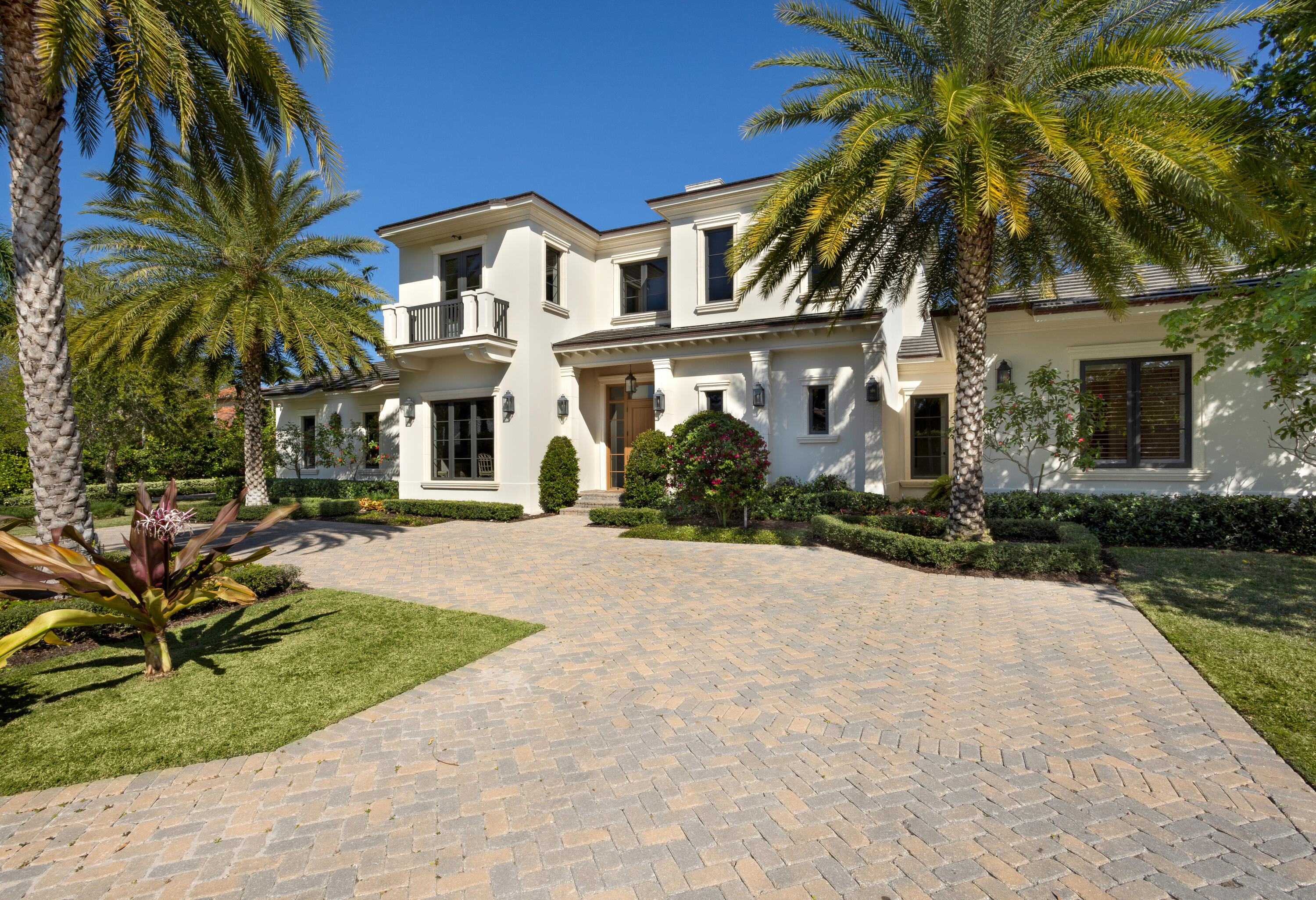 On a quiet cul-de-sac, just one block from the beach, the beautifully landscaped courtyard and circular driveway establish a grand sense of arrival, and in the turf-carpeted backyard, which is hedged for privacy, the loggia, with automatic screens and a summer kitchen, overlooks the heated pool with an overflow spa, and just adjacent, a play area is great for children. Its transitional-style detailed with classical adornments sets an elegant tone for this four-bedroom custom residence built by Richard Jones of Seaside Builder. With 6,362 +/- total square feet, its signature statement is refined glamor, with features that include wood floors, decorative volume ceilings edged with crown moldings, and custom built-in cabinetry. . Drama is achieved in the two-story foyer and main gallery, which introduce the living room, detailed by a beamed ceiling, a gas fireplace flanked by bookcases, and French doors offering a pool view and leading to the loggia. With an open concept plan, the dining room is just adjacent, featuring a coffered ceiling and a picture window offering courtyard garden views. The great room, which comprises a family room, breakfast area and gourmet kitchen, opens to the pool-view loggia. Inviting gracious entertaining and perfect for family living, the center-island kitchen is fitted with custom wood cabinetry, quartz counters, professional-grade appliances, and a pantry with built-in shelving, wine cooler and two refrigerator drawers. The first-floor primary suite, with French doors to the pool area and a volume ceiling, presides over the entire south wing of the residence and comprises two custom-fitted walk-in closets, a morning bar, and a spa-inspired bathroom finished with quartz and marble and fitted with custom cabinets, a multi-head shower, soaking tub, and water closet. Also on the first floor are a guest bedroom suite, laundry, powder room and two attached garages. On the second-floor, a loft area overlooks the foyer and serves two guest bedroom suites. Added pluses, the loft area can be closed off to serve as a fifth bedroom and features a French door that accesses the pool-view balcony. Both bedrooms also open to balconies. Other special amenities include hurricane-rated windows and doors, a concrete-tile roof, and three-Carrier air-conditioning systems.



The information herein is deemed reliable and subject to errors, omissions or changes without notice.  The information has been derived from architectural plans or county records. Buyer should verify all measurements.

DISCLAIMER: Information published or otherwise provided by the listing company and its representatives including but not limited to prices, measurements, square footages, lot sizes, calculations, statistics, and videos are deemed reliable but are not guaranteed and are subject to errors, omissions or changes without notice. All such information should be independently verified by any prospective purchaser or seller. Parties should perform their own due diligence to verify such information prior to a sale or listing. Listing company expressly disclaims any warranty or representation regarding such information. Prices published are either list price, sold price, and/or last asking price. The listing company participates in the Multiple Listing Service and IDX. The properties published as listed and sold are not necessarily exclusive to listing company and may be listed or have sold with other members of the Multiple Listing Service. Transactions where listing company represented both buyers and sellers are calculated as two sales. The listing company's marketplace is all of the following: Vero Beach, Town of Orchid, Indian River Shores, Town of Palm Beach, West Palm Beach, Manalapan Beach, Point Manalapan, Hypoluxo Island, Ocean Ridge, Gulf Stream, Delray Beach, Highland Beach, Boca Raton, East Deerfield Beach, Hillsboro Beach, Hillsboro Shores, East Pompano Beach, Lighthouse Point, Sea Ranch Lakes and Fort Lauderdale. Cooperating brokers are advised that in the event of a Buyer default, no financial fee will be paid to a cooperating Broker on the Deposits retained by the Seller. No financial fees will be paid to any cooperating broker until title passes or upon actual commencement of a lease. Some affiliations may not be applicable to certain geographic areas. If your property is currently listed with another broker, please disregard any solicitation for services. Copyright 2023 by the listing company. All Rights Reserved.