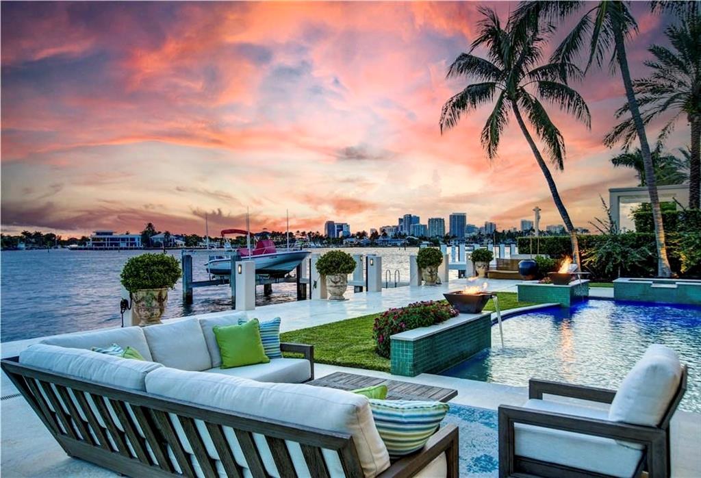 Exclusive gated Harbor Beach, 110’ DIRECT Intracoastal waterfront estate home, reminiscent of Santa Barbara, designed by award winning Stoftt Architects, built by Sarkela Corp.This residence is meticulously maintained and lives like a newly constructed property.The homesite was strategically acquired with the best views of and widest section of Intracoastal in mind and positioning to afford premium skyline sunset views of downtown Fort Lauderdale.Harbor Beach offers a truly one of a kind lifestyle, between your private oceanfront beach access, private yacht marina, to your intracoastal waterfront views, this really is your piece of paradise with the best of what So. Florida has to offer.Located only moment by boat to the Atlantic Ocean and ten minutes by car from FLL international airport. Meticulously maintained grounds accent the Spanish revival architecture of style of South California, including limestone façade, Pecky Cypress corbels, and iron accents to complete the vision. Upon entry to the dramatic 30’ foyer, the curved marble staircase embraces your senses and leads your eye to the unparalleled level of quality and detail. The expansive nature of this home is impressive while remaining very livable as well as elegant.Formal dining off the foyer presents with a contemporary design, ideal for entertaining with adjacent butler/serving pantry. Also transitioning you from the foyer, you are led into the formal living room, with robust cast stone gas fireplace, exquisite ceiling details, and arched hurricane impact doors optimize water views from every angle.This elegant formal space guides you into the billiard/game room, with extensive built ins, wet bar,Chevron Mahogany floors, and themed in a Morocan style Hookah lounge. The lower level of this home offers a temperature-controlled wine vault as well as the forethought of a potential elevator addition for the needs of any future owners. Nestled alongside a guest retreat easily accessible for guests requiring the ground level. On the opposing end of this layout is the heart of this home, a refined gourmet kitchen offering extensive eating/seating area, premium stainless appliances, including Viking 6 burner commercial grade gas range with dual ovens, Kitchenaid Convection microwave, warming drawer and dual 36” Sub Zero refrigerator/freezer. Intelligent design permit pass through to the outdoor bar area for true Florida living outdoors. The positioning of the kitchen also embraces the spacious family room which is accented with extensive use of Pecky Cypress beams and dramatic custom lighting and absolute stunning views of water throughout.The upper level provides four well designed suites including an impressive owner’s retreat, comprising nearly 35% of the upper level. The primary suite presents with a dramatic barrel vaulted ceiling, expansive 20x23 sleeping area with sitting room, and finished off with a dramatic wardrobe/dressing area. The expansive retreat offers a gracious owners retreat bath with floating soaking tub, dual sinks and separate walk in shower. The retreat is graced with a private covered terrace offering an additional sun deck. The primary guest suite is designed with a dramatic 17’ turret with incredible water views. The upper level has a separate living area with terrace spanning the entire width of this space. An additional spacious terrace is designed off the upper level guest retreat to the front of the home offering amazing sunrise views.In true Florida style, a Zen garden theme, accents the oversized heated salt water pool with water and fire features. Picturesque sunsets from your heated spa as you enjoy the tranquility of waterfront living. The upgraded seawall and premium 12’ finish cap offer 110’ of deep water frontage, accommodating up to a 90’ yacht. Current owner has lift offering 16,000lb capacity and accommodates a 38’ watercraft.Additional remarks;Three car garage with ample room for lifts to expand car storage capacity. Exceptional amounts of storage throughout the home. Entire attic dehumidifier. Four HVAC systems with zones. Entire grounds are irrigated and entire property has landscape lighting. Hurricane impact rated Pella windows and doors throughout. Separate Pool bath on North side of home accessible from the exterior. Entire house central vacuum system. 14918sf homesite with a 45 KW generator.