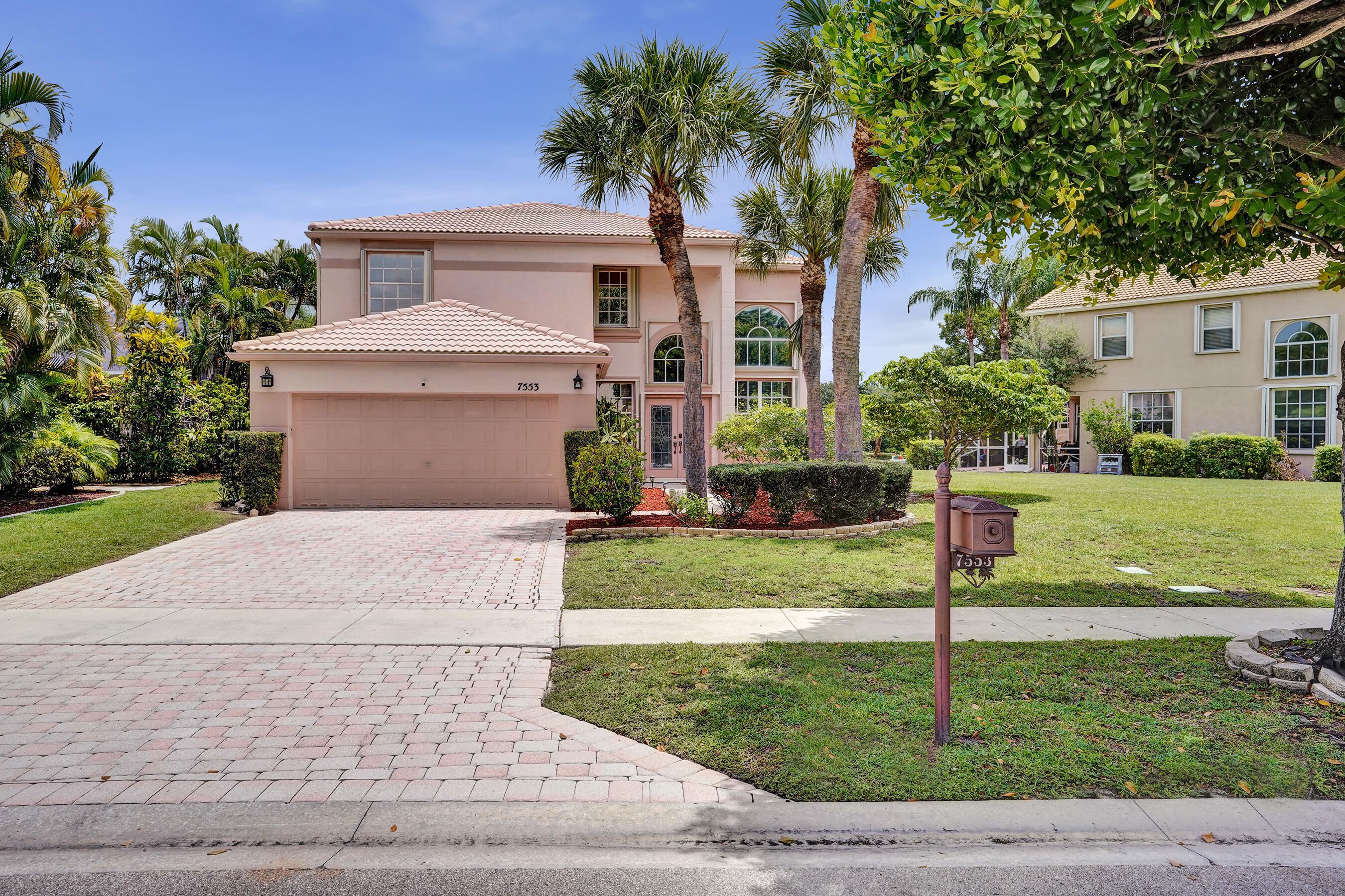 Welcome to this beautifully maintained 5-bedroom, 3-bath lakefront home offering the perfect blend of space, comfort, and privacy. A first-floor bedroom and full bath provide an ideal setup for multigenerational living or guests. Soaring ceilings and expansive windows bathe the home in natural light while showcasing a serene cypress preserve and lake backdrop. Designed for comfortable living and effortless entertaining, the home features spacious formal and casual living areas, Brazilian chestnut wood floors, a walk-in pantry, an updated secondary bath, generous secondary bedrooms, and an expansive primary suite with a sitting area. Enjoy exceptional privacy in highly sought-after Smith Farm with top-rated schools, shopping, dining, and convenient access to major roadways.