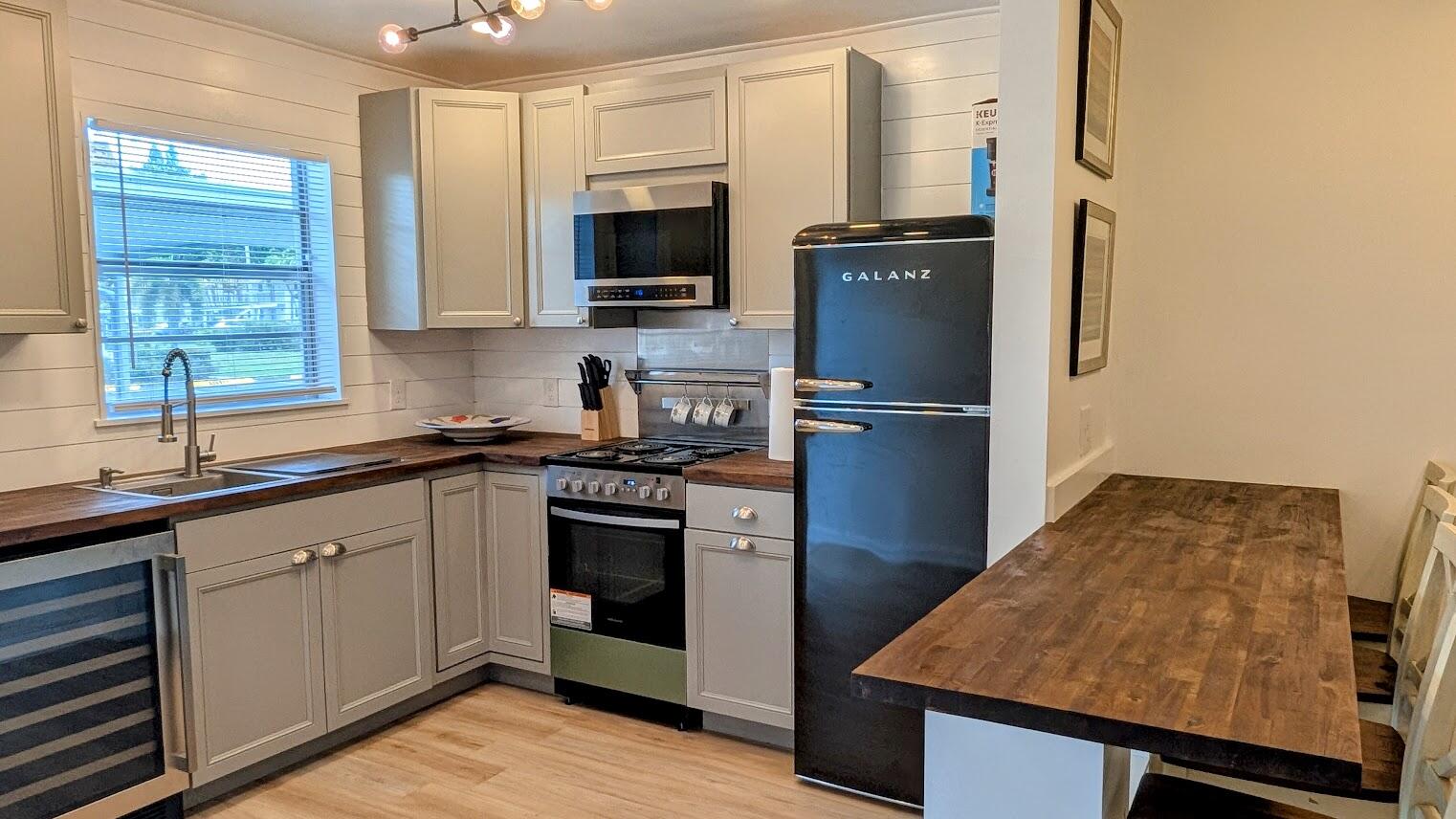 Excellent Value, Great Location + Move-In Ready! Perfect First Floor Remodeled Condo (Furniture negotiable) with an ALL NEW Re-Imagined *Start of the Art* Kitchen! Light & Bright interior with No carpeting, Luxury Vinyl Plank flooring & relaxing Garden Views from your private Glass enclosed Florida room. Fully Included in your Condo dues are Water, Basic Cable, Sewer, Building Insurance, Lawn Maintenance + A Covered Carport! ! Steps to the Swimming Pool & Clubhouse & access to a Lake-side walking Trail. Quick & Convenient to Historic Downtown Stuart including Boutique Shoppes, Cafes, Fine Dining, the Lyric Theater & the scenic Riverwalk along the St. Lucie River -PLUS- under 3 miles to Hutchinson Island Beaches.