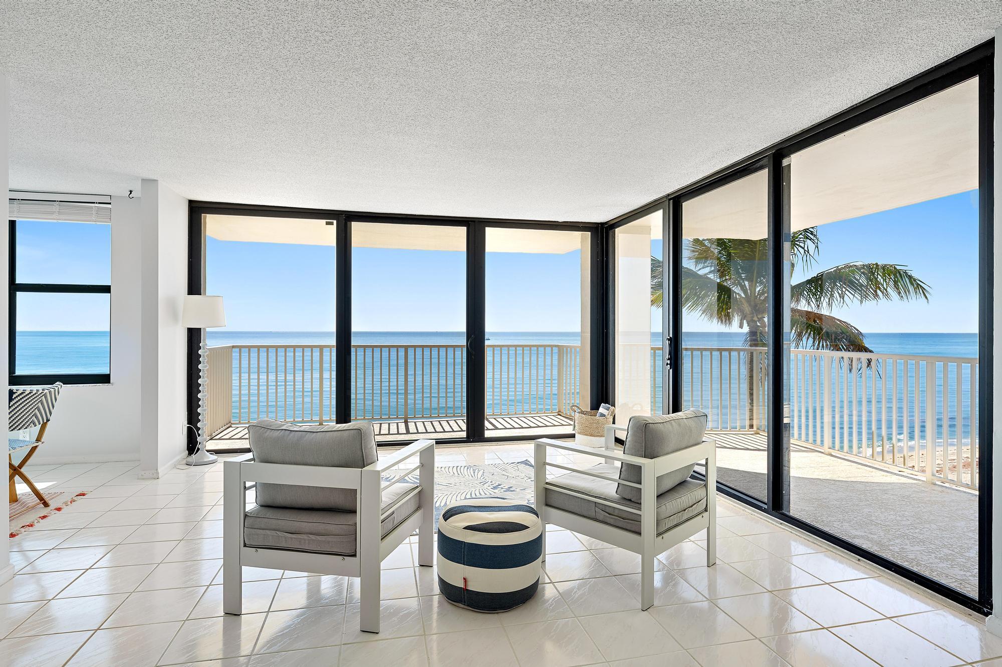 STUNNING! DIRECTLY ON THE OCEAN! Newly upgraded condo on Singer Island. This beautiful 2 BR / 2 BA unit has a breathtaking direct view of the ocean. The upgrades include fresh paint, new flooring in bedrooms, new ceiling fans, new bathroom vanities and new mirrors and lights in primary bathroom. It has one covered carport parking spot and shared free laundry room conveniently located on every floor right outside the unit. Dunes Towers is on the pristine north end of Singer Island. Come and enjoy the outstanding blue waters of The Atlantic Ocean and The Intracoastal Waterway views from the wrap around balconies. Lovely amenities include heated pool with ocean access, resident's clubhouse, fitness room and BBQ picnic area.