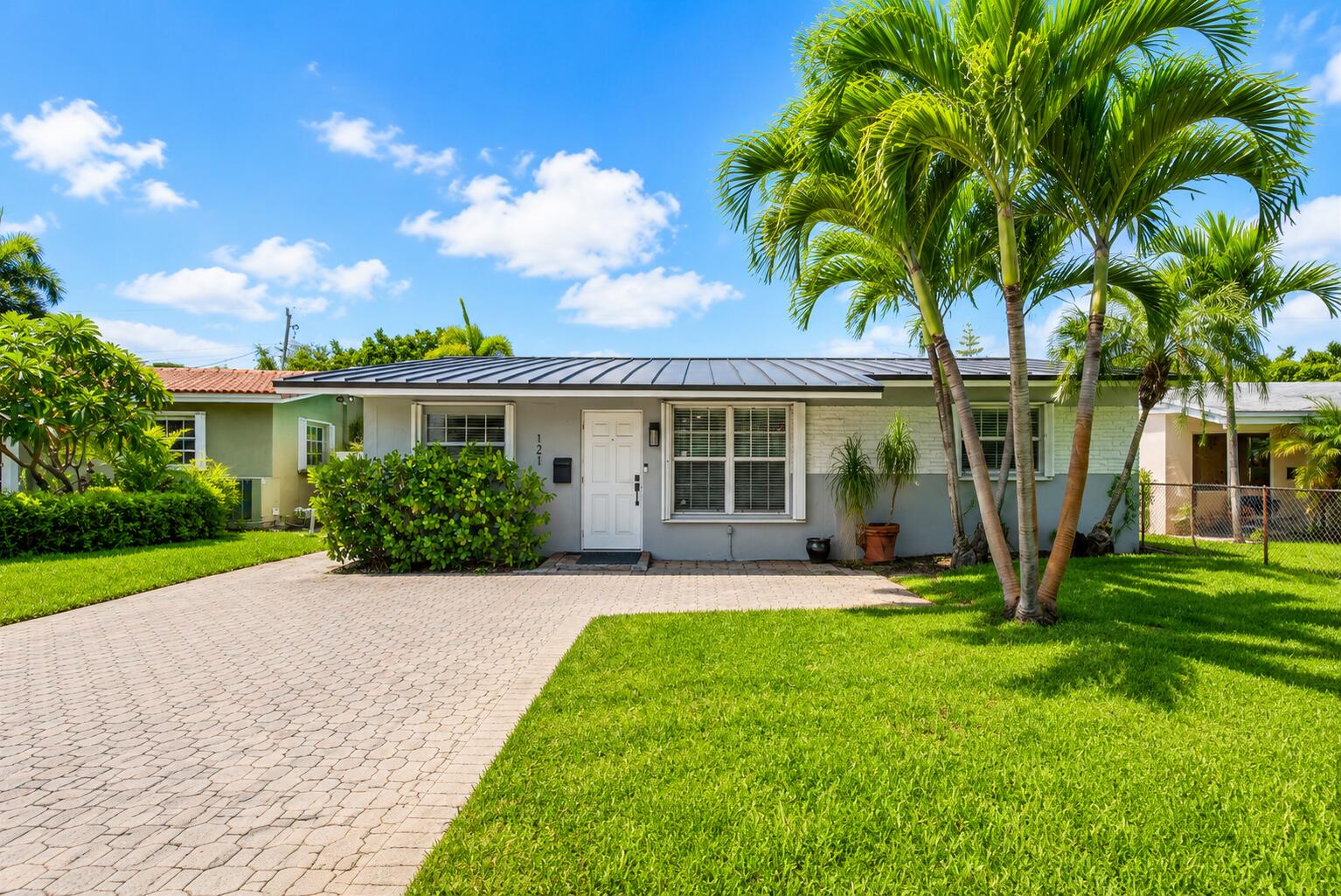 Beautifully updated 2-bedroom, 2-bath home with a versatile office/den in Oakland Park! This move-in-ready home features new tile flooring, fresh interior paint, modern lighting, a new metal roof (2024), new HAVC (2025), updated electric panel, hurricane shutters, and impact-rated doors. Bright, open living spaces and thoughtful upgrades make this home truly turnkey. The spacious backyard offers plenty of space to add a pool. Conveniently located just minutes from I-95 and under 4 miles to the beach, close to shopping, dining, and the North Andrews Gardens Community Center. Don't miss this opportunity to own a beautifully maintained home, schedule your private showing today!
