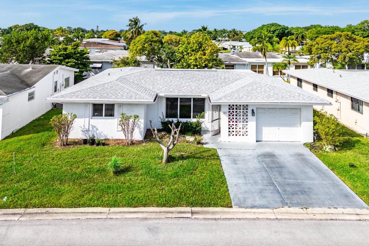 Welcome to Paradise Gardens, a well located, active 55+ community. This home offers a spacious, airy floorplan with all of the "bones" you're looking for. The roof was installed in 2020, impact windows and doors throughout, updated kitchen, ample bedrooms and plenty of closet/storage space! You are located right on top of the highly rated Oriole Golf Club with plenty of other clubs nearby as well. The community offers a clubhouse with pool and events room which is constantly active with community events. If you are looking for an active yet relaxed place which is well located close to all of your daily needs, then this one is worth a visit!