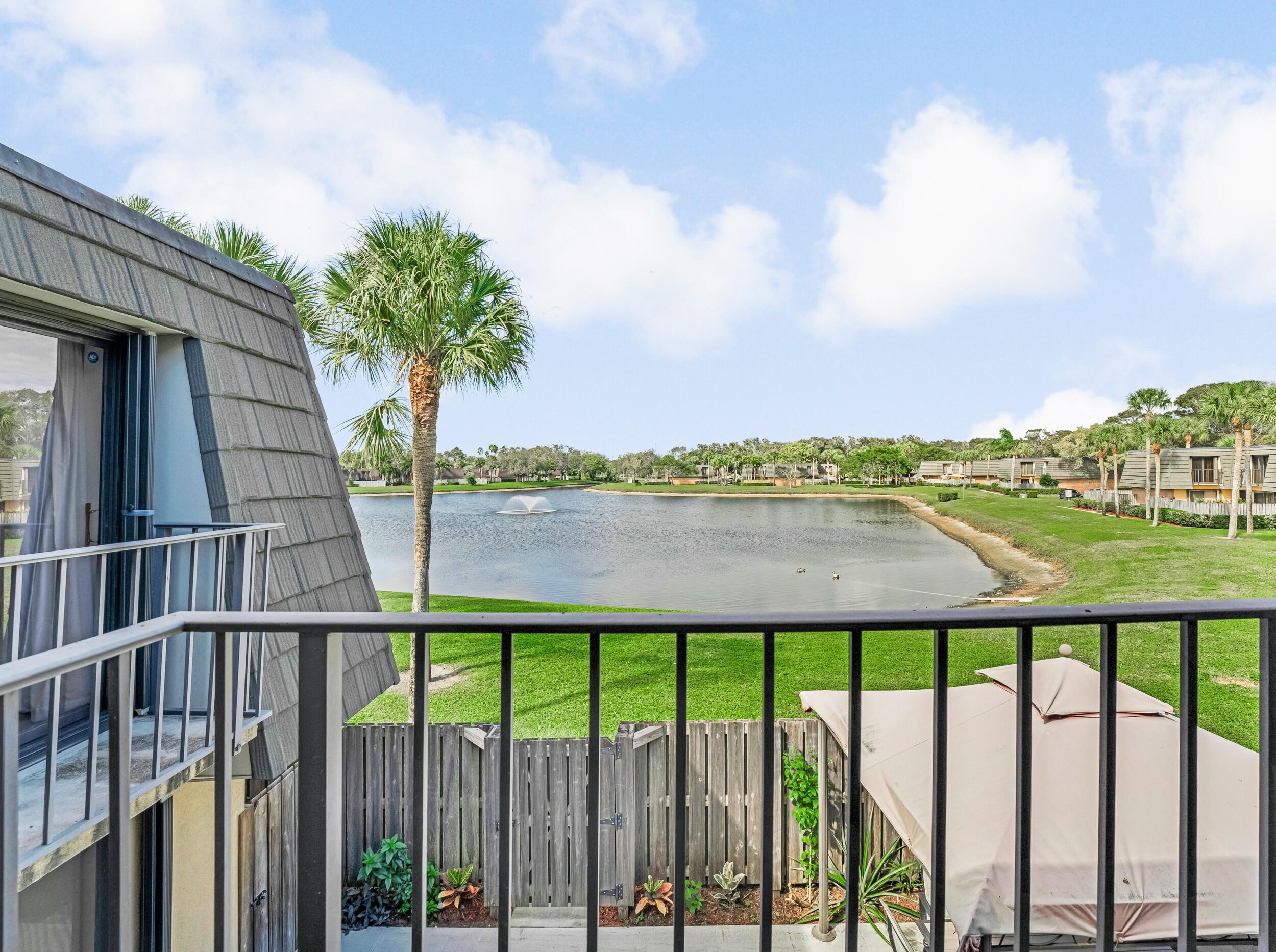 Front lake property offering an incredible South Florida living experience. This FULL FURNISHED 2 bedrooms, 2.5 bathrooms townhouse has it all. Enjoy a spacious living area, a fully equipped kitchen with stainless steal appliances, a full-size washer and dryer, and a convenient half bathroom on the first floor. The primary suite features a walk-in closet and serene lake views. Accordion shutters throughout provide added convenience and peace of mind. Step outside to your private patio, perfect for relaxing or entertaining family and friends. Water, basic cable, and internet are included. The community offers 2 assigned parking spaces, plenty of guest parking, pool, tennis courts, and scenic walking trails. Ideally located with easy access to I-95 and the Florida Turnpike, and more.