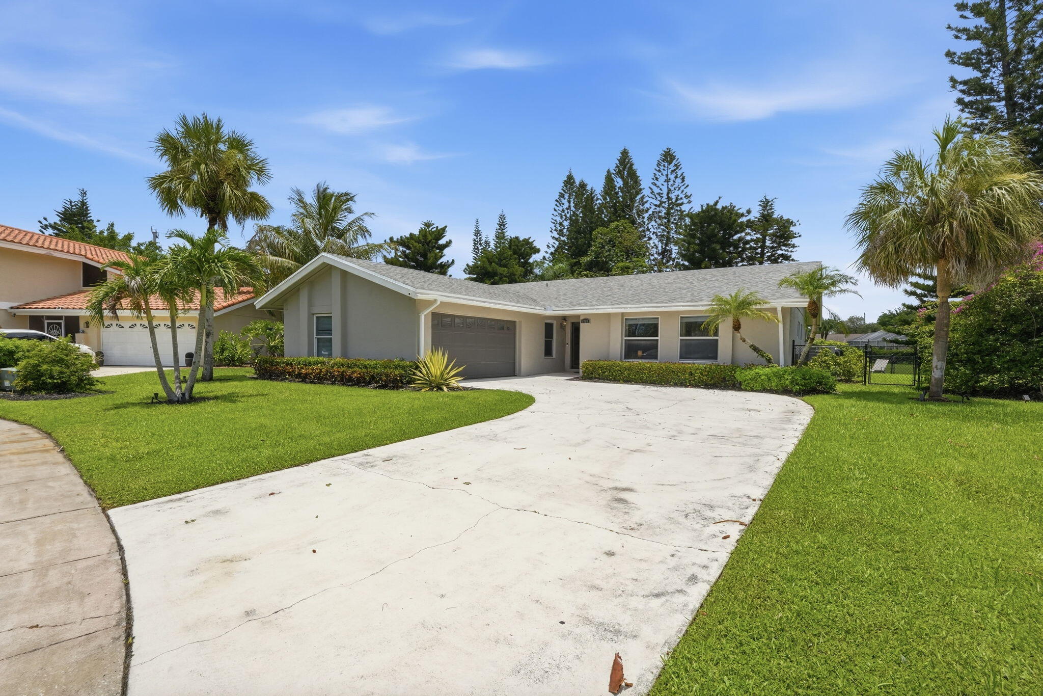 Prime Wellington Equestrian Investment Opportunity - No HOA! Beautifully renovated canal-front pool home situated on a fully fenced 1/3-acre lot in one of Wellington's most desirable equestrian locations. This exceptional property has undergone extensive updates over the past few years and has been successfully operated as a seasonal rental/Airbnb, offering outstanding income potential. The home features a fully updated kitchen, renovated bathrooms, impact windows, new tile flooring and numerous modern upgrades that make it move-in or rental-ready. Enjoy Florida living at its finest with a newly resurfaced and screened-in pool, new pool deck, and a fully equipped outdoor kitchen complete with barbecue and refrigerator—perfect for entertaining guests and seasonal renters alike The expansive, fully fenced backyard provides privacy and plenty of space for pets, outdoor activities, or future additions. The property overlooks a peaceful canal and includes an irrigation system supplied by canal water, helping reduce utility costs while maintaining lush landscaping. Ideally located near Wellington's world-renowned equestrian venues, shopping, dining, Wellington Green Mall, and top-rated schools. With no HOA restrictions, this property offers exceptional flexibility for homeowners, investors, and seasonal rental operators. Whether you're looking for a primary residence, winter retreat, or income-producing investment property, this turnkey Wellington home checks all the boxes.