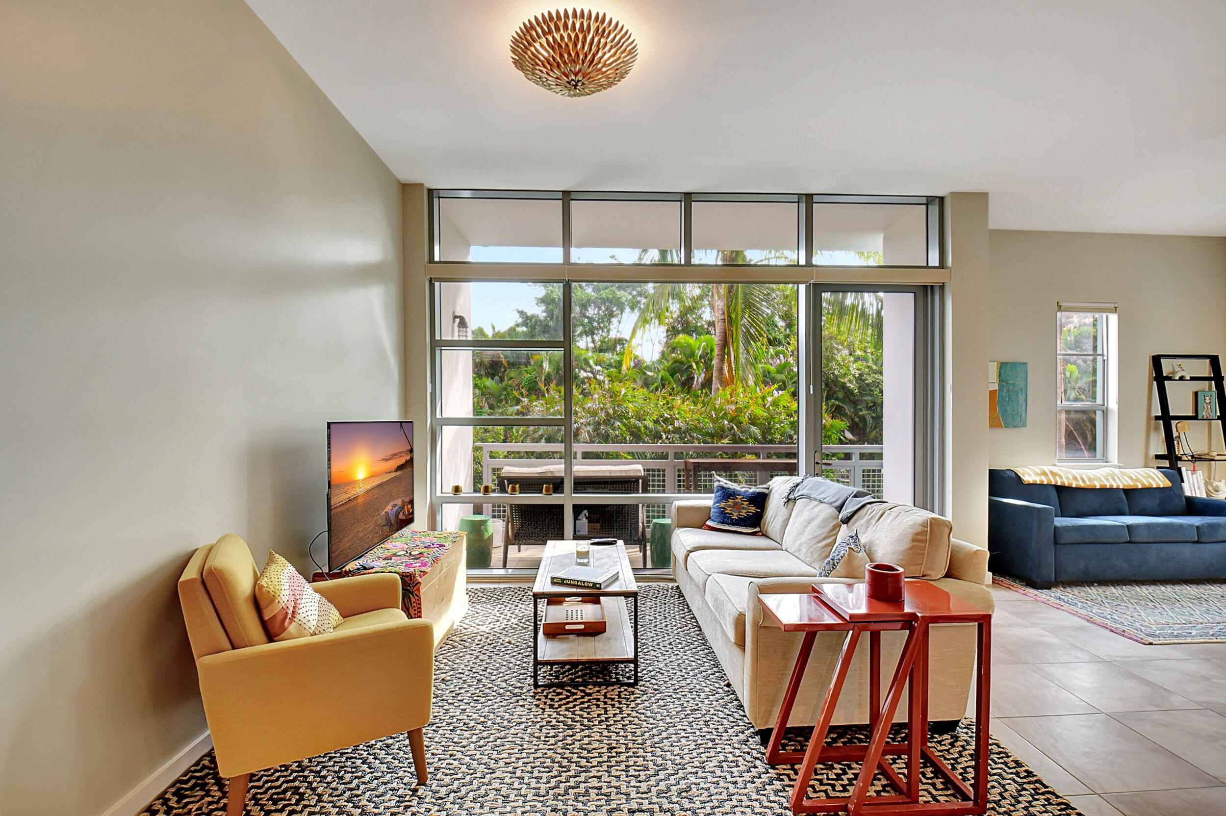 Fully furnished ANNUAL rental at The Meridian in downtown Delray Beach, steps to Atlantic Avenue dining and less than 1 mile from the beach. Bright east-facing 1BR + flex space with nearly 1,000 SF, soaring 14-ft floor-to-ceiling windows, and a large balcony overlooking greenery on the quieter back side of the building. Furnished for owner occupancy with high-quality pieces, including king Saatva Plush pillow-top bed, walk-in closet, double dresser, desk, 55" smart TV, and Queen Tempur-Pedic barless pull-out bed in flex space. Renovated bath with walk-in shower. Kitchen includes newer appliances and in-unit washer/dryer. The Meridian offers fob access, assigned garage parking, guest parking, and a heated rooftop pool with lounge seating, high-top tables, and WiFi. Fully furnished annual rental at The Meridian in downtown Delray Beach, steps to Atlantic Avenue dining and less than a mile from the beach. This bright, east-facing 1-bedroom + flex space offers nearly 1,000 square feet, soaring 14-foot floor-to-ceiling windows, and a large balcony overlooking greenery on the quieter back side of the building.   The unit was furnished for owner occupancy with high-quality, brand-name pieces and comfort in mind.  The bedroom includes a king-size Saatva Plush pillow-top bed, walk-in closet, double dresser, and desk. The renovated bathroom features a walk-in shower with bench and a toilet with bidet.  The open living area includes a comfortable sofa and a 55-inch smart TV.  The balcony has both loveseat seating and dining space, making it useful for morning coffee, outdoor meals, or working outside.  The kitchen includes newer appliances, including a new dishwasher, microwave, refrigerator, freezer, under-sink filtration system, and in-unit washer/dryer.   The flex space on the other side of the unit includes storage, a dining area, and a second couch with a Queen Tempur-Pedic barless pull-out bed, creating a separate sleeping area for guests away from the living room.   The Meridian is a well-kept boutique building with fob access, lobby entry, assigned garage parking, ample guest parking, and a heated rooftop pool with lounge seating, high-top tables, WiFi, and sunrise and sunset views.    Lease details: Furnished ANNUAL rental. Monthly rent includes: parking, WiFi, cable, and water.  Tenant pays electric.  Dogs and cats considered by landlord on a case by case basis, and will charge pet fees accordingly. Move in requirement: First month, last month, security deposit, and tenant screening with proof of income/employment. Association application fee is $150 per person or married couple, must show proof of marriage if last names are different. Refundable $500 move in deposit given back at the end of the lease. Non-refundable $500 dog fee. Association approval may take up to 30 days, though it is often faster.