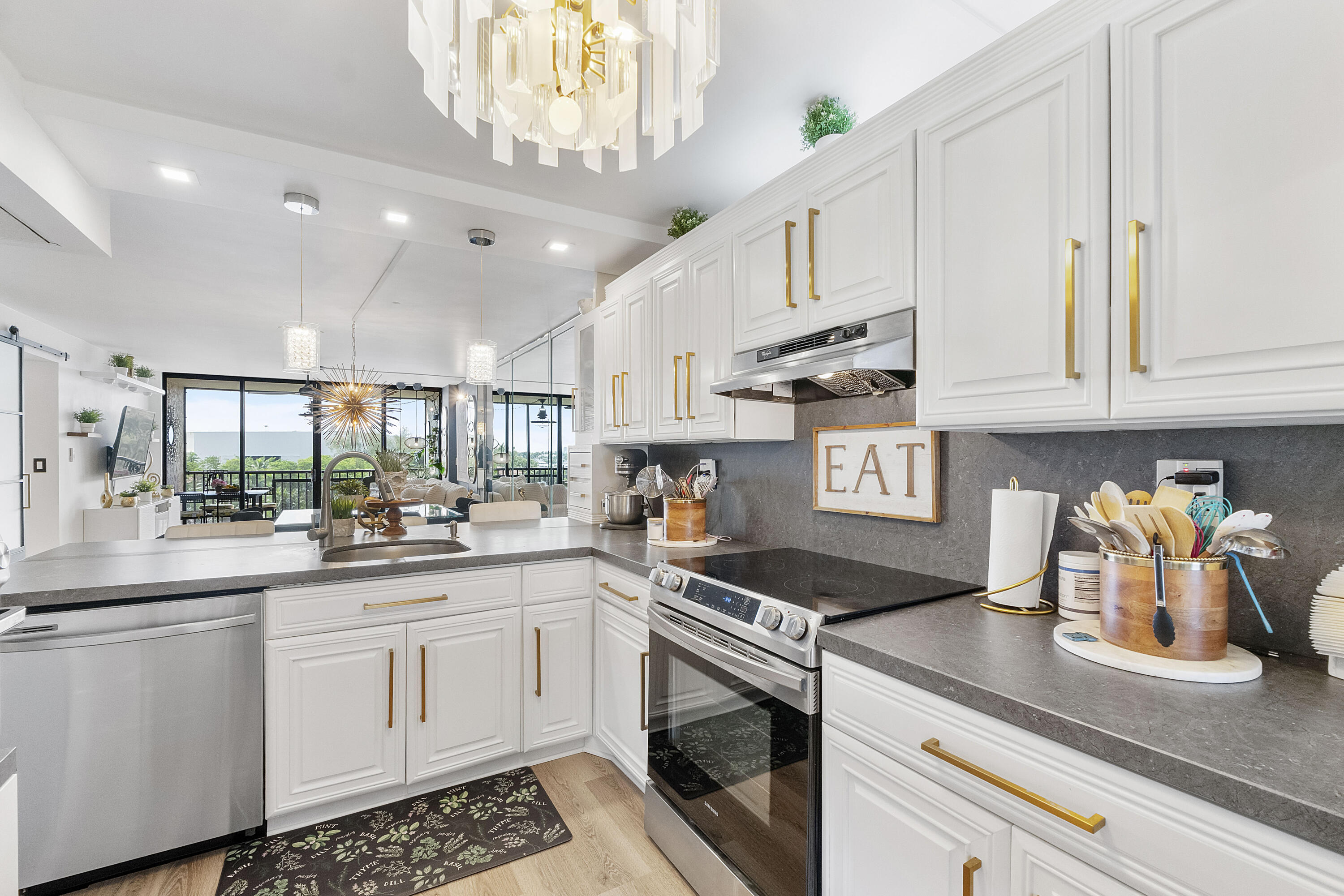 Experience waterfront living in the gated community of Boca Bayou in Southeast Boca Raton. This beautifully updated 2-bedroom, 2-bath condominium features all-new flooring, renovated bathrooms, and stunning sunrise views overlooking the Hillsboro Canal. Enjoy the community's newly completed clubhouse and amenity upgrades, along with five pools, tennis courts, 24/7 gated security, and resort-style living just minutes from downtown Boca Raton, beaches, shopping, and dining. The maintenance fee includes water, cable, building insurance, and more. FURNTIURE AVAILABLE FOR ADDITIONAL PURCHASE.