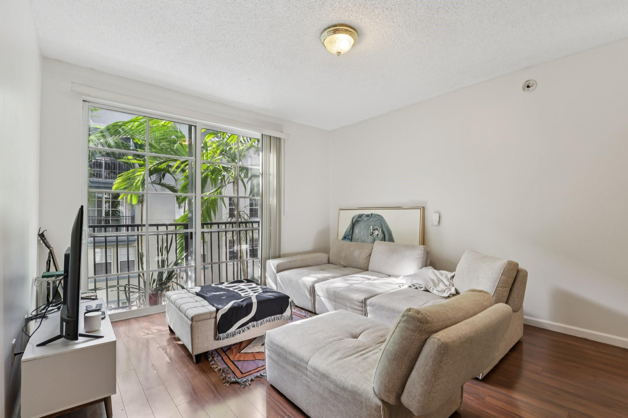 Great investment opportunity or ideal option for an owner-occupant, featuring the largest 1 bedroom plus den floor plan. The unit offers a walk-in kitchen with a washer and dryer closet and peaceful atrium views with a water fountain visible from every window. Spacious living and dining areas are complemented by a separate den ideal for a home office or additional sleeping area. The large bedroom includes a walk-in closet, and the bathroom offers ample cabinetry. The building features a pool, clubhouse, fitness center, elegant lobby with on-site management, covered garage parking, a beautifully maintained atrium courtyard with fountains, and secured gated entry. Located close to Las Olas dining and entertainment, minutes from the beaches, with easy access to us-1 and i-95.