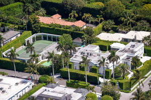 Grande Gottfried Regency on Polmer Park. Oversized +/-37,000 square foot lot, 5BR/6.2BA, media room, exercise room, tennis pavilion, large pool, and cabana with sauna. Beautiful dining room, high ceilings, lush gardens, terrace with fountain, and 3 car garage.