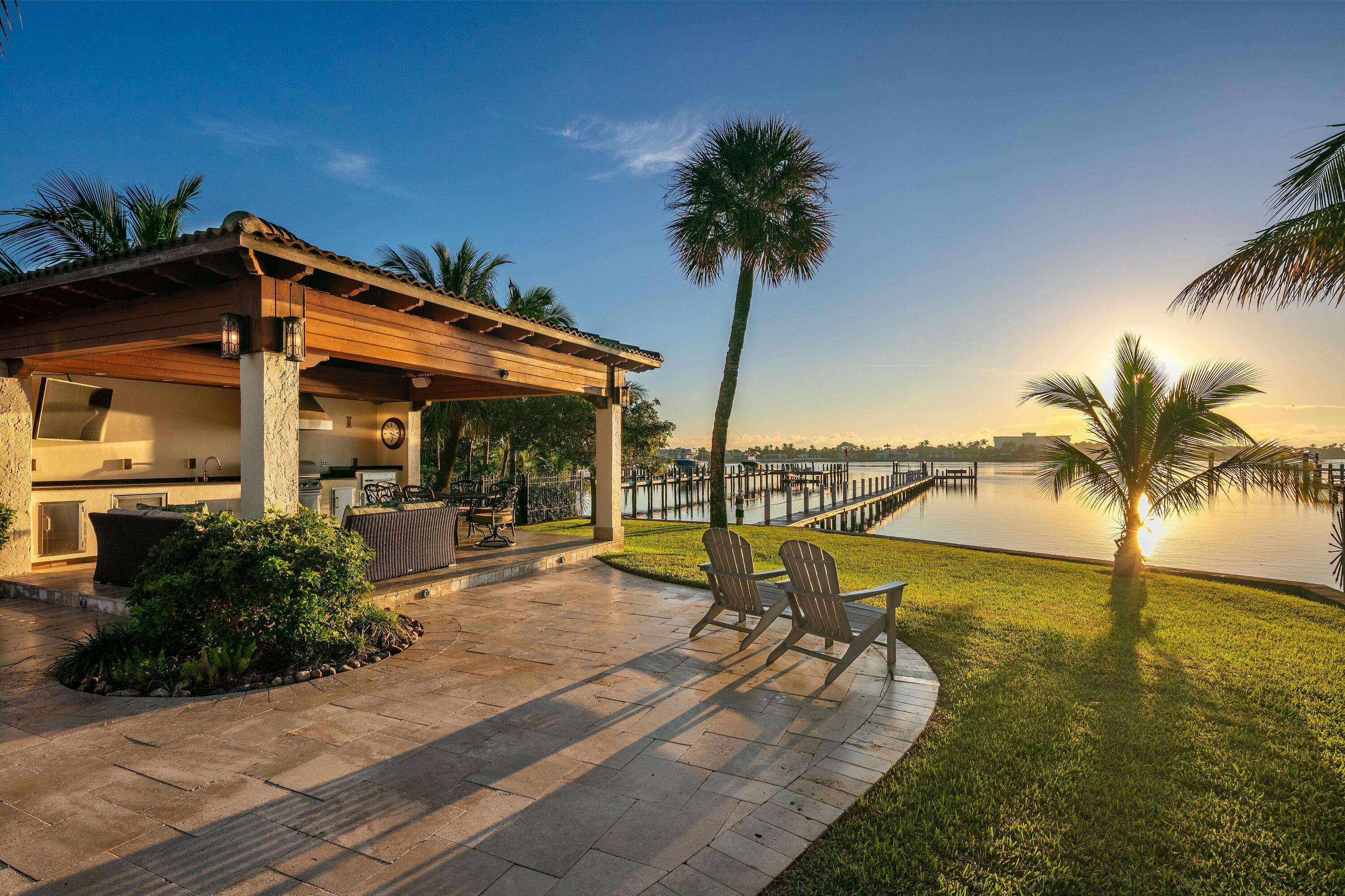 Welcome home to your direct intracoastal paradise which boasts a 4 bedroom, 3 bathroom home featuring approximately 81 feet of water frontage and a 276' dock equipped with an 8 ton boat lift. The immense saltwater pool and covered pavilion complete with a summer kitchen, propane grill, storage closet, half bath & outdoor shower make it the perfect place to host friends & family year-round. Renovations from 2011 to 2013 included a new seawall, Wolf & Sub-Zero appliances, new A/C system, new electrical wiring, new plumbing and full impact windows & doors. Experience the magical sunrise views each morning and the very best dining, shopping & beaches from its' unique central location. The ultimate boating & entertaining lifestyle is found right here in this Lake Worth Beach gem.