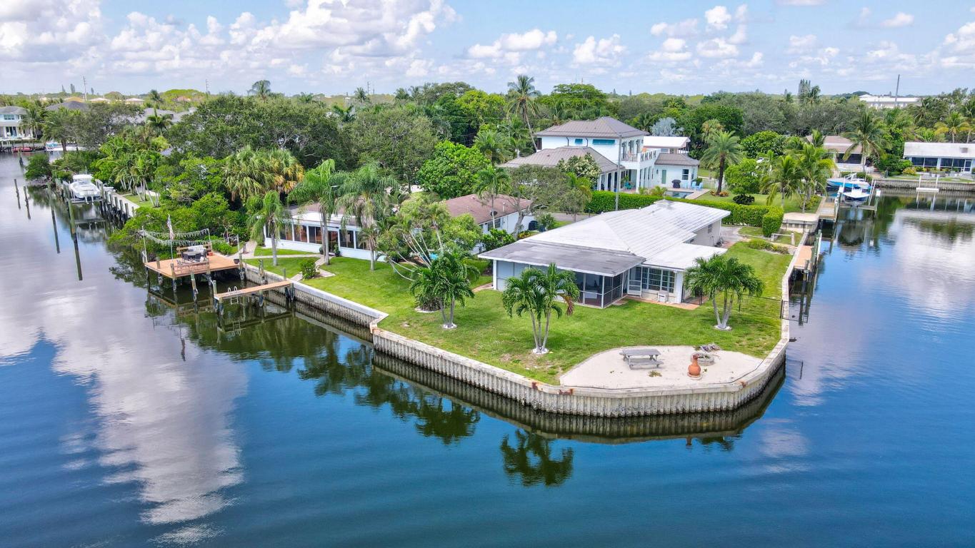 Prime Waterfront Development Opportunity - A Boater's Dream

An extraordinary opportunity awaits in one of South Florida's most sought-after waterfront enclaves. Perfectly positioned for avid boaters and anglers alike, this rare offering features two separately deeded parcels totaling over half an acre with a remarkable 300 feet of deep-water frontage—all with no fixed bridges and preserve views.

Nestled in a quiet, non-HOA community east of the Brightline corridor, the location offers swift access to open water, combining ultimate privacy with unbeatable convenience. Whether you're looking to build a sprawling estate or develop two custom homes, the possibilities are as expansive as the waterfront itself.