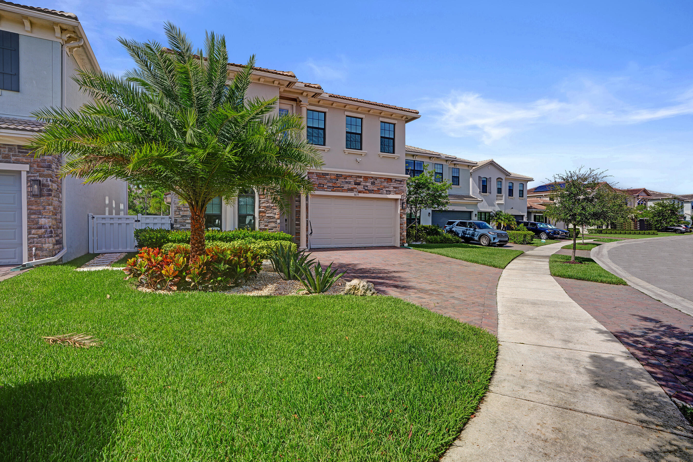Stunning 5-year-old home in gated Coral Lago, recently renovated and perfect for large families. Master + office on the main floor, with 4 bedrooms and a loft upstairs—ideal for space, privacy, and plenty of storage. Features built-out closets, new laundry room, impact windows, security system & cameras. Backyard oasis offers palms, custom lighting, outdoor grill, and a heated pool with direct access to an oversized community green space. Beautiful, move-in-ready home. Easy to show!