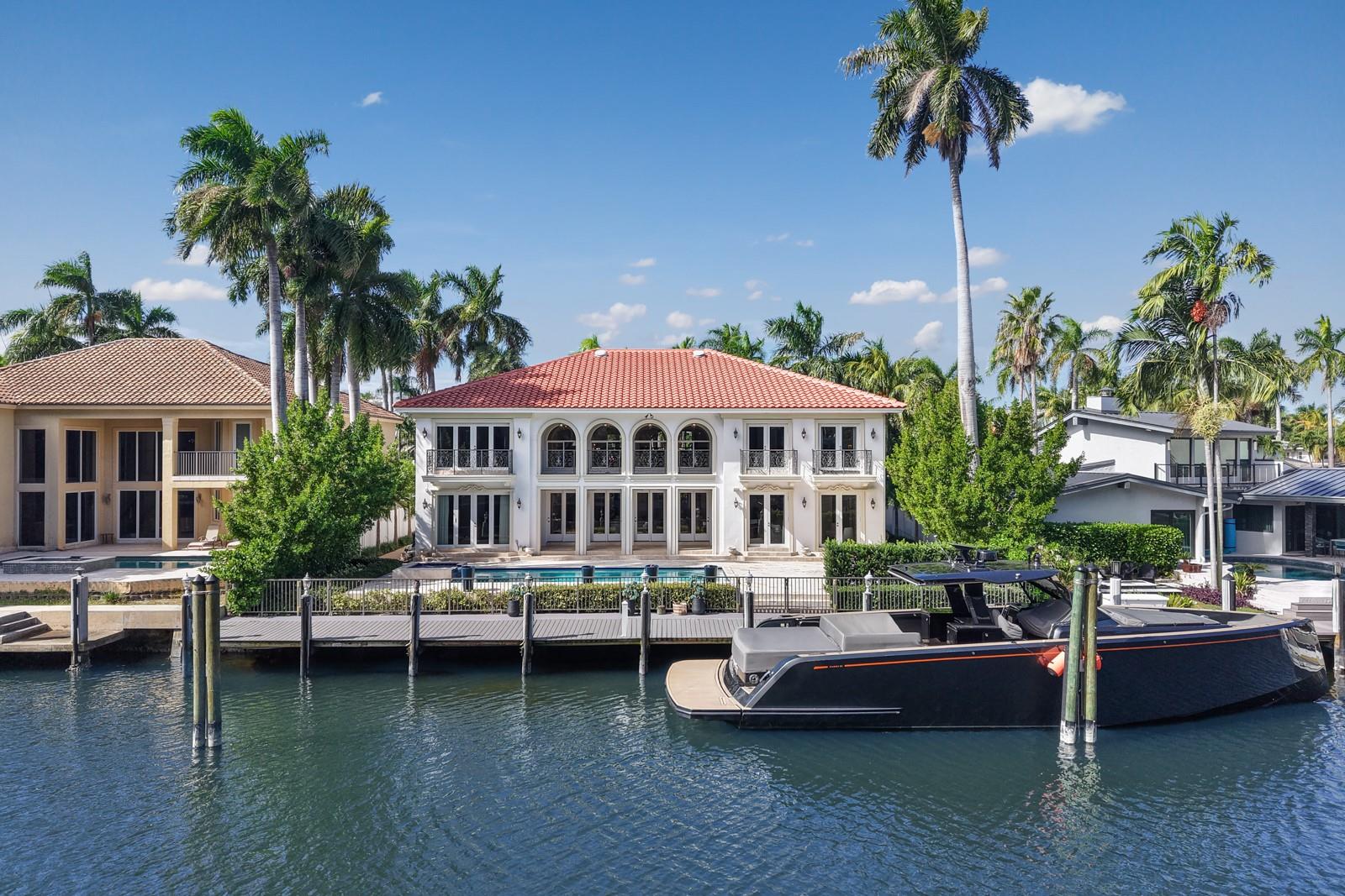 An exceptional estate on Las Olas Isles showcasing soaring ceilings, grand living areas, & refined architectural detail throughout. This elegant residence blends timeless style with modern comfort. Filled with natural light & tranquil waterfront views, this home offers a seamless flow between indoor & outdoor living. The gourmet kitchen offers premium appliances, custom cabinetry, & generous space designed for effortless entertaining. The primary suite offers a stunning spa inspired bathroom, custom closets, & terrace with waterfront views. Outside, a resort style pool & spa provide the perfect setting for relaxation. With 85 ft of waterfront & direct ocean access, this home captures the essence of sophisticated South Florida living moments from Las Olas, fine dining, & the beach.