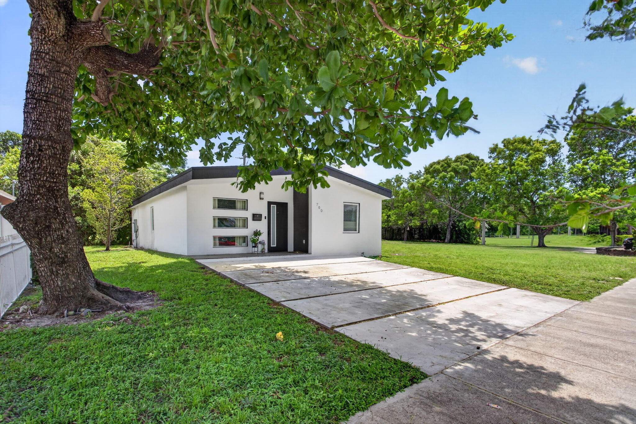 Welcome to this beautifully updated 3-bedroom, 2-bath home, recently constructed in 2021 and designed with comfort, style, and convenience in mind. This move-in-ready property features impact windows, updated electrical, a newer water heater, and a modern updated kitchen that opens seamlessly into the spacious living and dining areas. The open floor plan creates a bright and inviting atmosphere, perfect for everyday living and entertaining. Ideally located near major streets and interstate access, this home is close to shopping, dining, entertainment, and just minutes from the beach. Best of all, there is no homeowners association, giving you added flexibility and freedom. A wonderful South Florida opportunity.