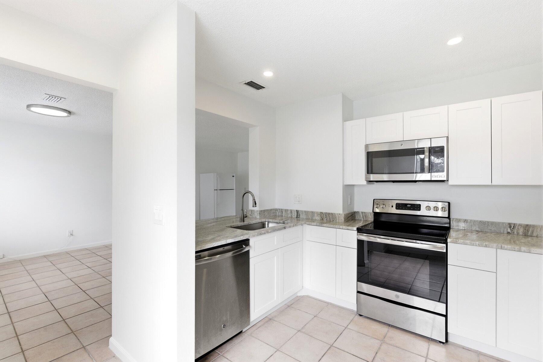 Fresh, bright, and move-in ready 2-bedroom, 2-bath condo in the heart of Coral Springs. This unit has been thoughtfully refreshed with an updated kitchen featuring stainless steel appliances, renovated bathrooms, and updated flooring in the bedrooms. The layout is open and functional with great natural light throughout, creating a clean, modern feel from the moment you walk in. Enjoy a private screened patio and convenient access to the community pool. No age restrictions and rental-friendly, making this an ideal opportunity for both homeowners and investors looking for a turnkey property in a central location close to shopping, dining, and major roadways.