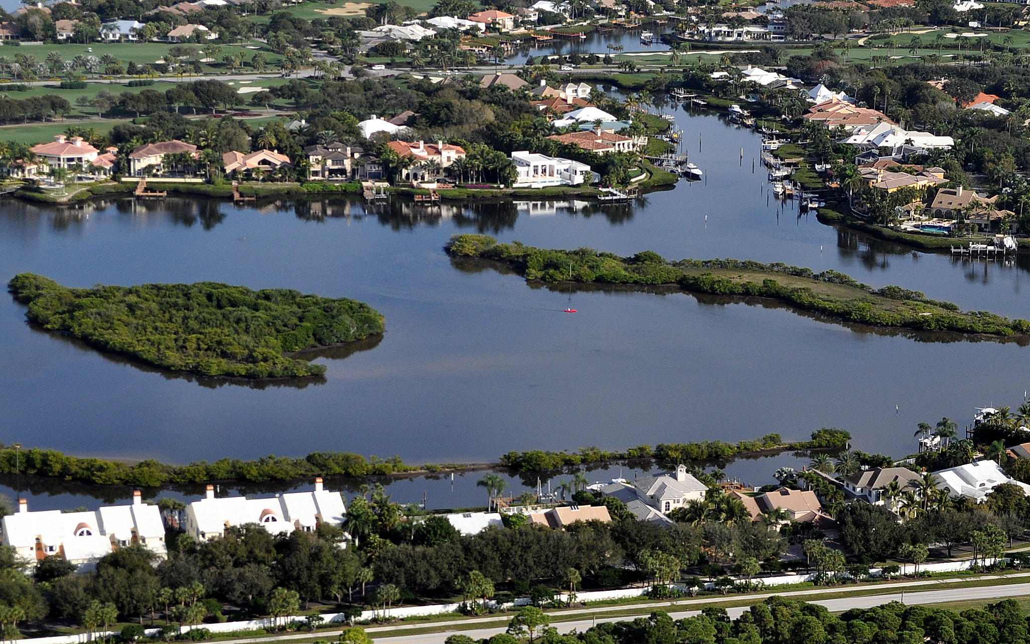Water, water, water...the views from this lot in Admirals Cove which is accessible by water are unparalleled and is home to a 2015 brand-new, 2-story, 5-bedroom, master down, open floorplan, British West Indies-styled home designed by Mitch Kunik, President of the reknowned and award-winning architectural firm, Affiniti Architects. Prospective purchasers may view this site and be given a tour of a representive furnished model. The floorplan is equally stunning