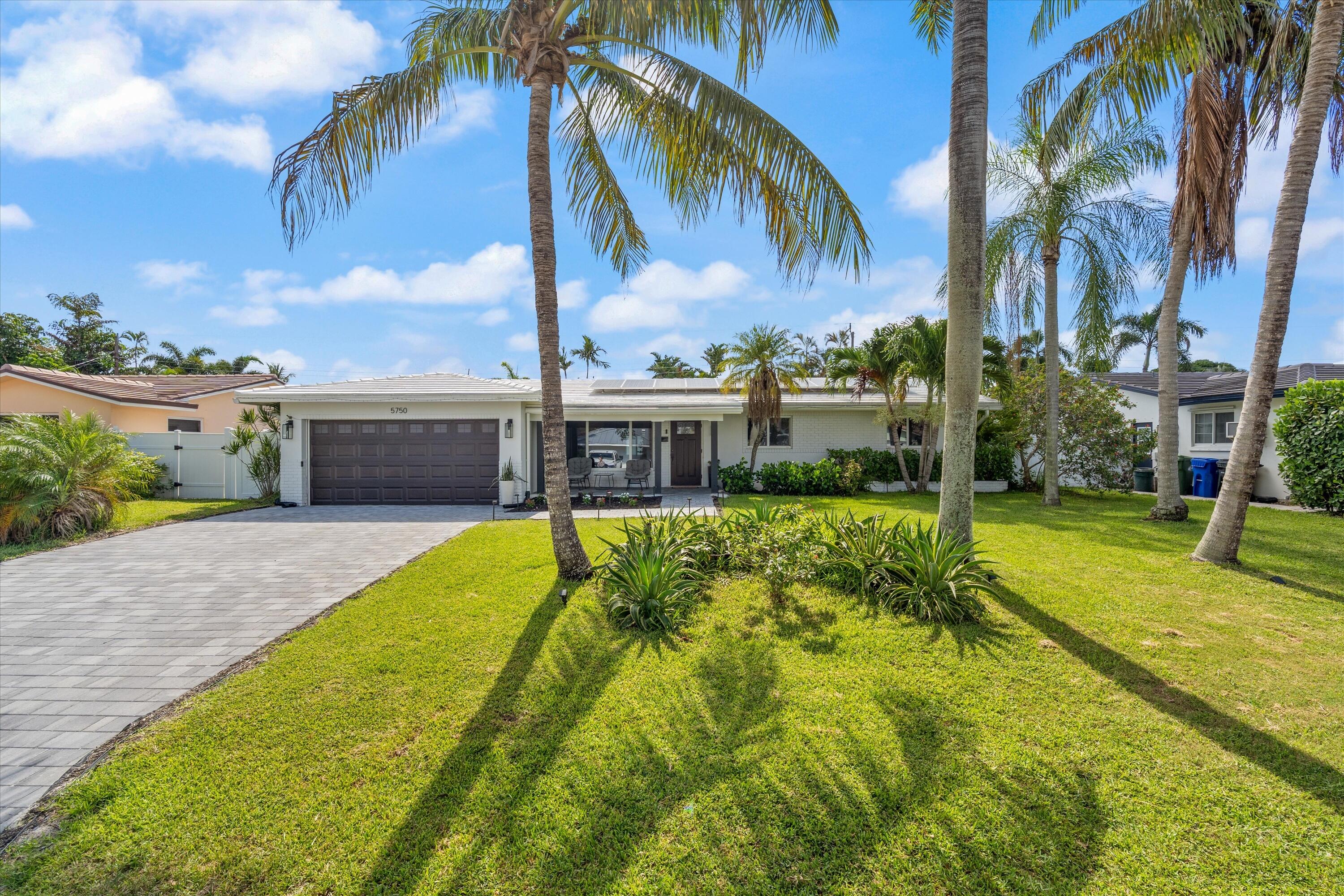 Exceptional value in the highly sought after Imperial Point neighborhood. Just minutes from Lauderdale-by-the-Sea, this beautifully updated 4 bed, 2 bath pool home offers the South Florida lifestyle you've been searching for. Designed for entertaining, the private backyard oasis features an oversized pool, new hot tub, and plenty of room to relax or host family and friends. Inside, you'll find a freshly painted interior, laminate flooring throughout, a butler's pantry including a wine cooler, a renovated bathroom, and a custom built-in closet in the primary bedroom. Impact windows and doors, 33 owned solar panels for energy savings, tankless water heater, a brand new paver driveway complete this move-in-ready home.