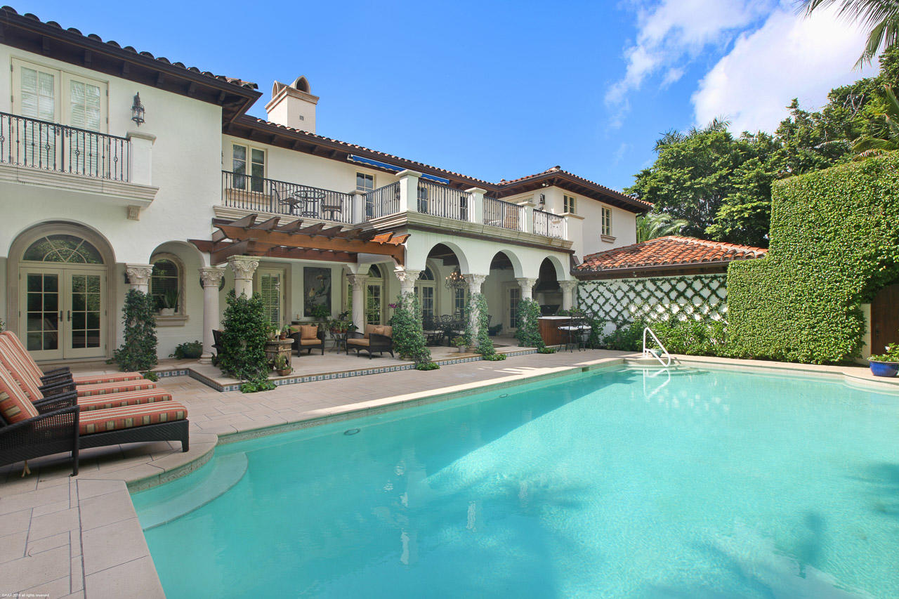 If you only see one house this season make it this one.!
 One of the most beautiful estates in the center of town built by Paul Whittman- 7,840 sq ft. of splendor, and charm, absolute perfection.
Exquisite in town location. Mediterranean two- story estate on an oversized private lot with lush landscaping and gorgeous expansive gardens, security gates, and cameras. 4 bedrooms,5 baths, his and her baths, elevator, gourmet Chef's kitchen, balconies, rich cypress and beautiful detailing throughout ,3 car garage, large pool and wonderful loggia and summer kitchen. If you only see one house this season make it this one.