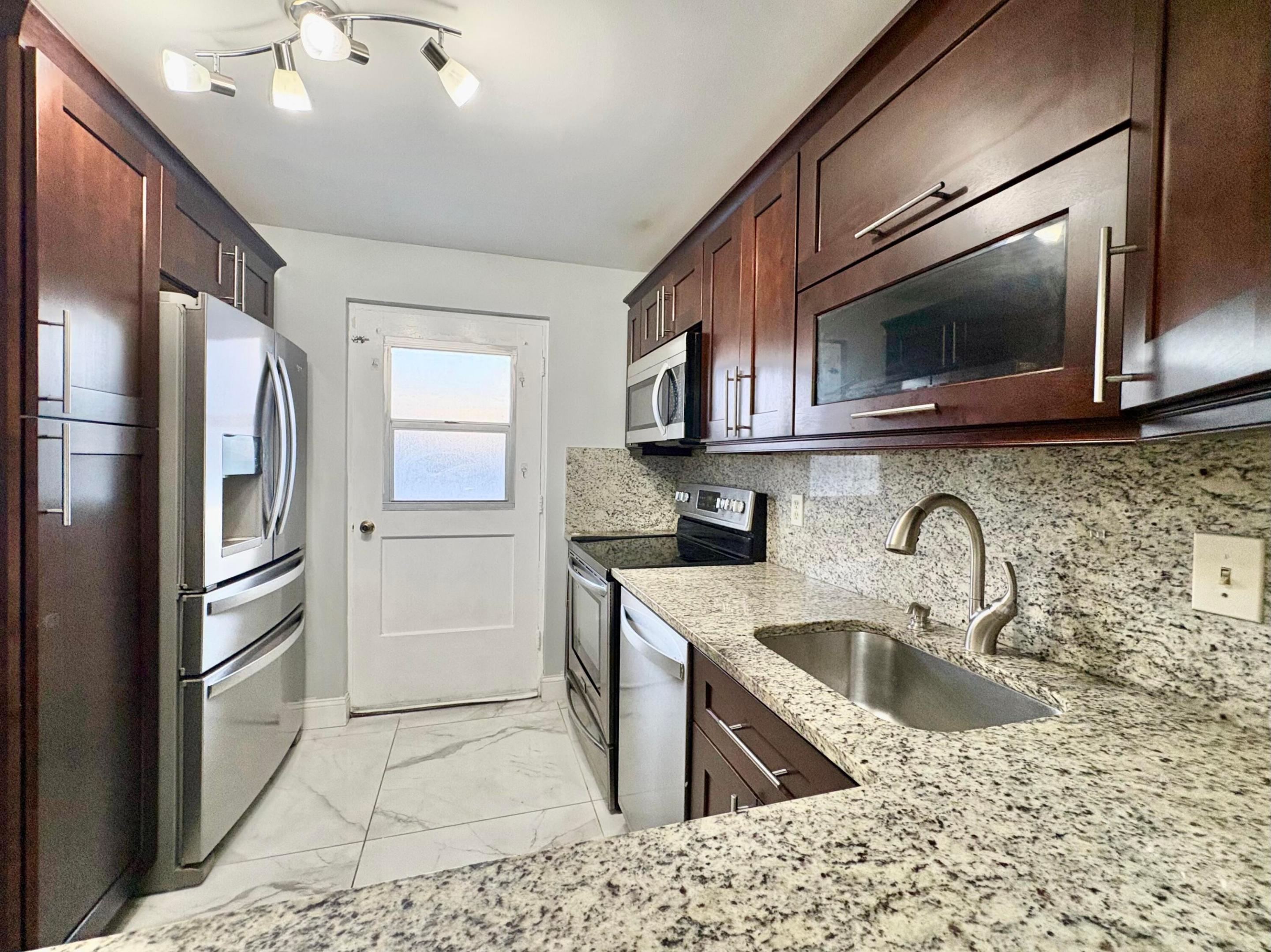 Live in the heart of Boca Raton in this spacious 2-bedroom, 2-bath condo with a den, located in an all-ages building east of I-95. The unit is offered unfurnished and includes water, basic cable, and internet. Community laundry facilities are conveniently located just steps from the front door. Perfectly positioned for students, faculty, and professionals, with Florida Atlantic University and Lynn University only minutes away. Enjoy a low-maintenance lifestyle close to shopping, dining, coffee shops, fitness centers, movie theaters, parks, and everyday conveniences. Spend weekends at the beach, just minutes from the Atlantic Ocean, or explore the vibrant downtown areas of Boca Raton and Delray Beach, known for their restaurants, nightlife, festivals, and cultural events. Convenient acces  to both Palm Beach International Airport and Fort Lauderdale-Hollywood International Airport makes travel easy. NEW PHOTOS TO COME after the tenant moves out of the unit.