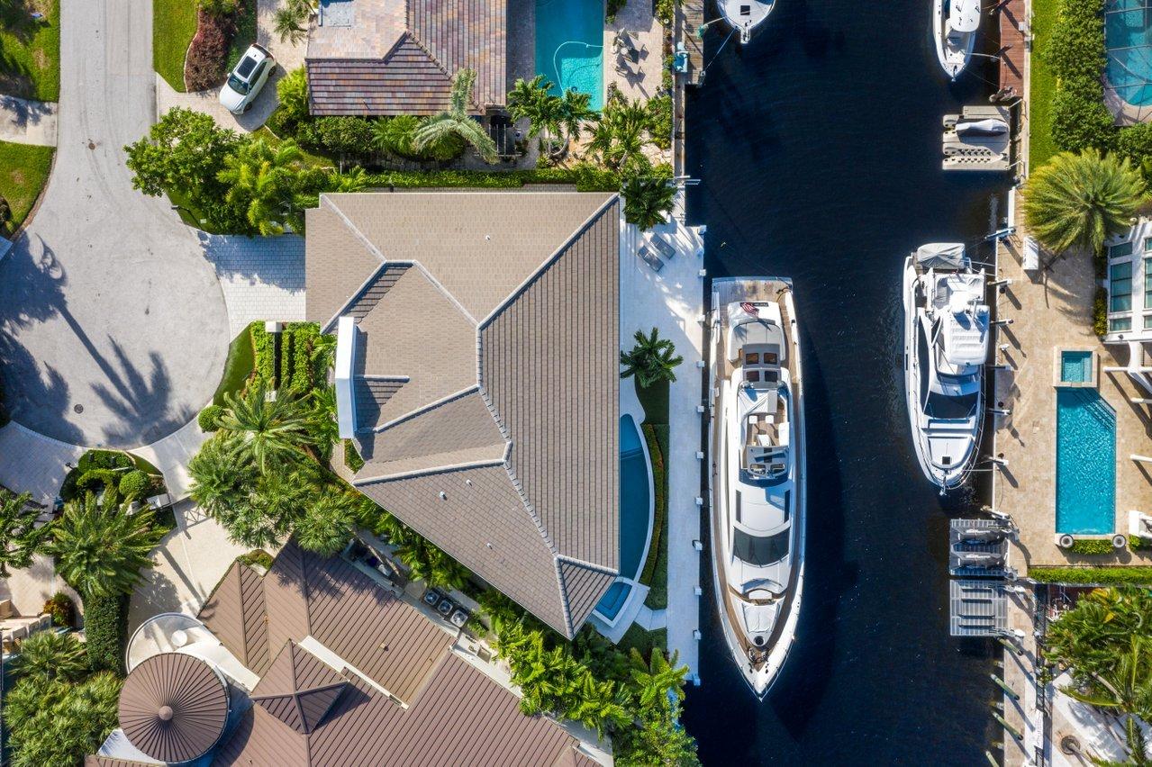 When only the best will do. New construction modern West Indies waterfront estate perfectly encompasses every whim of your imagination. This expertly appointed smart home of your dreams is a jewel of the Mary Widmer Luxury Collection where attention is given to every bit of its design and detail from the platinum ¾ inch marble and French white oak flooring to the custom metal and glass staircase. Dining is a memorable event in the gourmet appointed kitchen with S.S. Subzero and Thermador appliances. Keep your wine collection pristine in the temperature-controlled wine room and entertain your guests in the clubroom. Fully equipped state-of-the-art smart home technology including Waupaca elevator, Lutron lighting system, Control4 Home Automation, and pre-wired for preferred security system.
