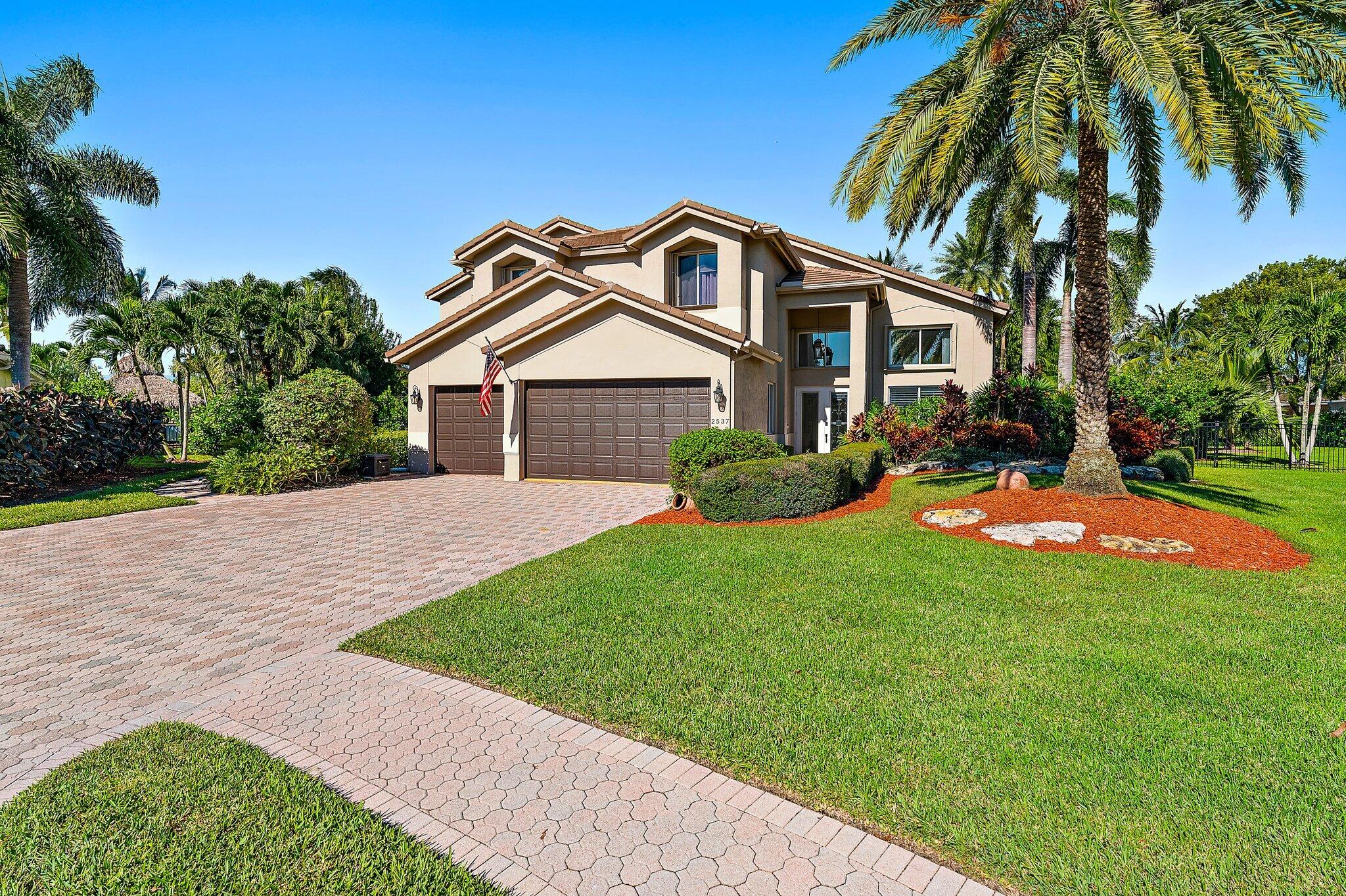 Set on a quiet cul-de-sac on just over a half-acre with views of the pond, this move-in ready pool & spa home offers scale, comfort & thoughtful updates throughout. Featuring 6 bedrooms, 5 full baths, a game room, fully fenced yard & nearly 5,000 sq ft, the residence is enhanced by all new impact windows & doors, plantation shutters, new carpet & a custom feature wall with fireplace. The kitchen is appointed with stainless steel appliances, marble countertops & an oversized island with seating for four, opening to spacious living areas designed for everyday comfort & effortless entertaining.  A large family room & game/play room provide flexible space for gathering, work or recreation. Upstairs, the expansive primary suite features a sitting area, built-in walk-in closet, dedicated workspace & newly renovated spa-like bath. Outside, enjoy a pool, spa & new oversized covered outdoor living space designed for relaxing, dining & entertaining.