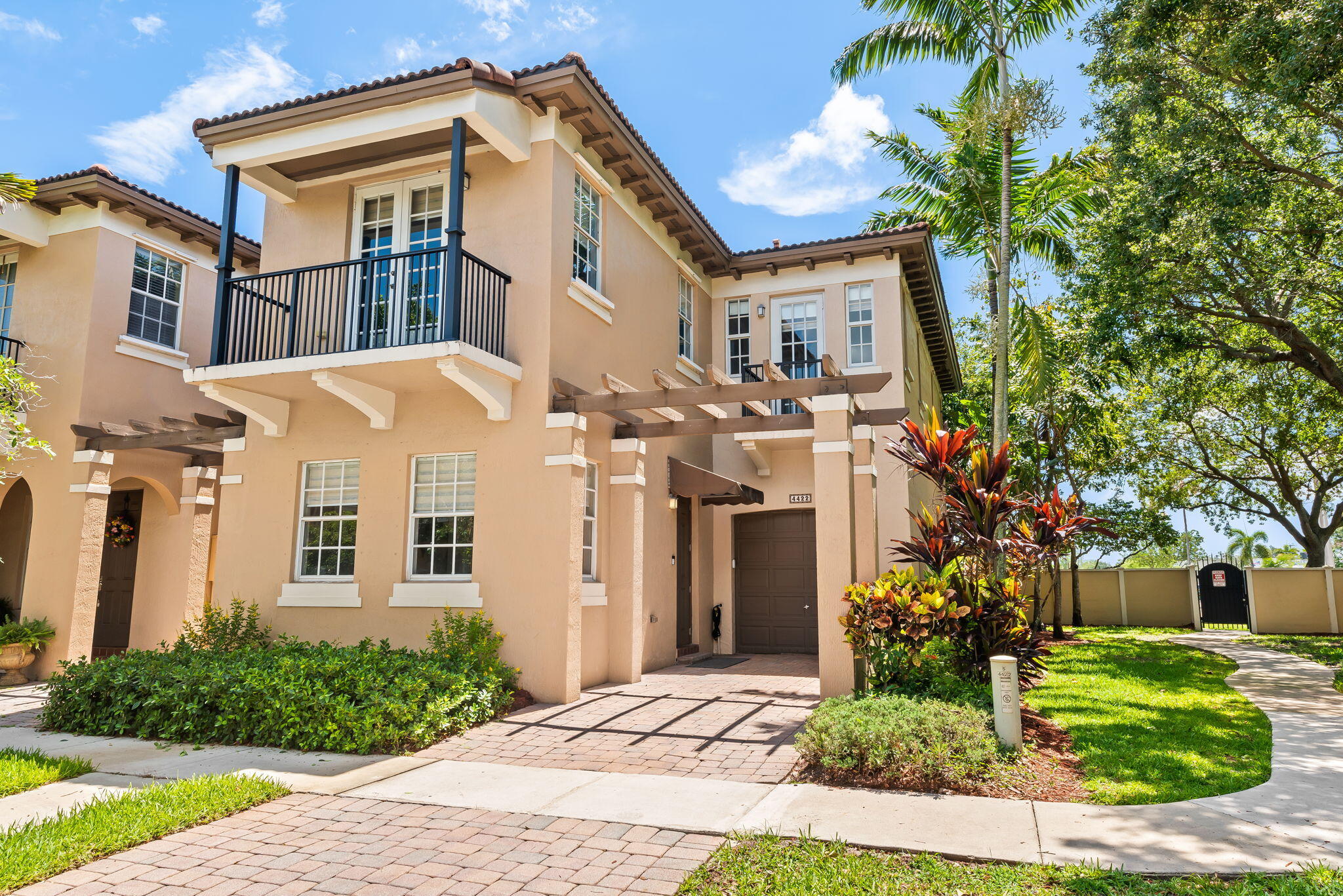 Charming corner townhouse nestled in the highly desired, Cimarron of Davie! This south Florida jewel boasts 4 bedrooms, 3 FULL baths, and a loft. One bedroom and one full bath located on first floor. Galley kitchen complete with granite counters and stainless refrigerator. Open floor plan, light and bright, with exquisite hardwood flooring and stylish zebra blinds throughout. Upstairs bedrooms have blackout shades. Ensuite primary bedroom has two walk-in closets. Fabulous outdoor space with fruit tree and large fenced-in patio ideal for Floridian entertaining, or kids and pets at play. One car garage, additional parking in driveway and guest parking. Community boasts pool and child play area. Minutes from Nova and Nova teaching hospital. TOP RATED SCHOOLS