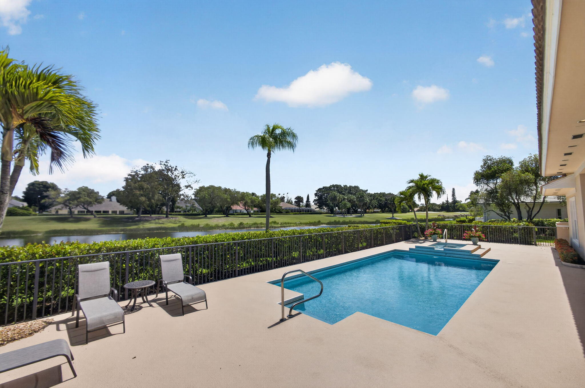 Perfectly positioned on one of the most coveted lots in Preston at PGA National, this elegant estate showcases breathtaking lake and golf course views with coveted southern rear exposure, filling the home with beautiful natural light throughout the day.   Offering 4 bedrooms, 3 full and 1 half baths, and over 3,300 square feet of refined living space, this residence blends timeless sophistication with effortless Florida luxury living. Dramatic cathedral ceilings, skylights, recessed lighting, and expansive formal living spaces create a bright and airy ambiance from the moment you enter.  Designed for both entertaining and everyday comfort, the home features an open kitchen with center island, multiple formal and casual gathering spaces, and a formal dining room ideal for hosting.  Sunlit living spaces and expansive windows draw attention to the home's spectacular outdoor backdrop, overlooking the oversized pool, spa, serene lake, and rolling golf course beyond.   Located within the prestigious guard-gated Preston community at PGA National Resort, residents enjoy access to one of South Florida's premier golf and country club destinations. Optional membership offers world-class amenities including championship golf courses, tennis, pickleball, resort-style pools, luxury spa and salon services, fitness facilities, members lounges, and fine dining. The renowned PGA National Resort, featuring a luxury hotel and multiple acclaimed restaurants, is just moments away.   A rare opportunity to own what is truly considered one of the finest lots in the community, offered at $1,950,000.