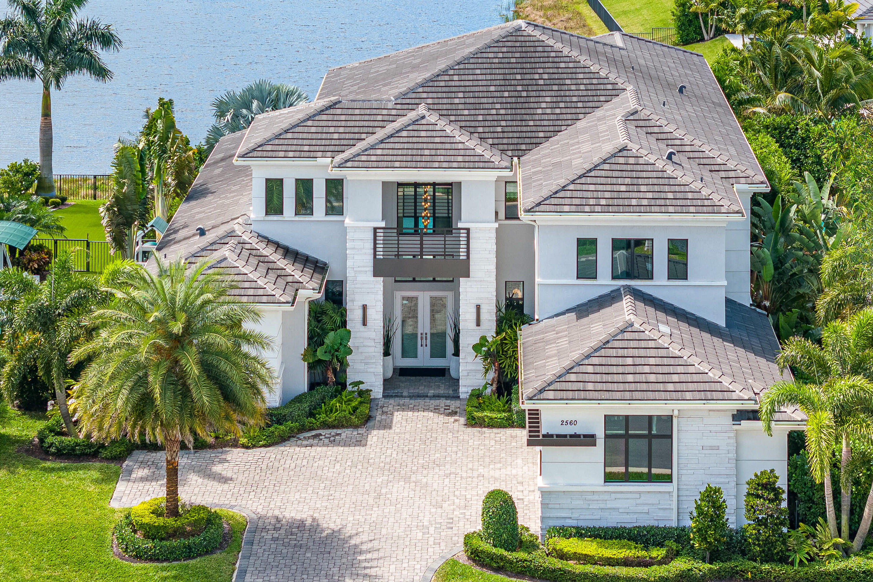An unmatched residential offering. An exceptional opportunity awaits in Boca Raton! This sprawling custom Delanna II model boasts over 5500 square feet, 6 bedrooms including two master suites, a home office, bonus room, a loft, 3 car garage, full house generator, reverse osmosis water system, Control 4 smart home system & more. Situated on one of the most desirable lots within the community.  Southern exposure with long lake views complete with salt water pool, summer kitchen and putting green. Built in 2020 by Toll Brothers and custom designed interiors by Miami's own IG Workshop, this estate home oozes with well thought aesthetics and modern sophistication. A true design master piece. Turn Key optionality. Royal Palm Polo is centrally located and zoned for all A+ rated Calusa, Omni & Spanish River. A quick drive to top notch private schools. Enjoy pristine community amenities including pool, gym, tennis and pickle ball courts & club room.