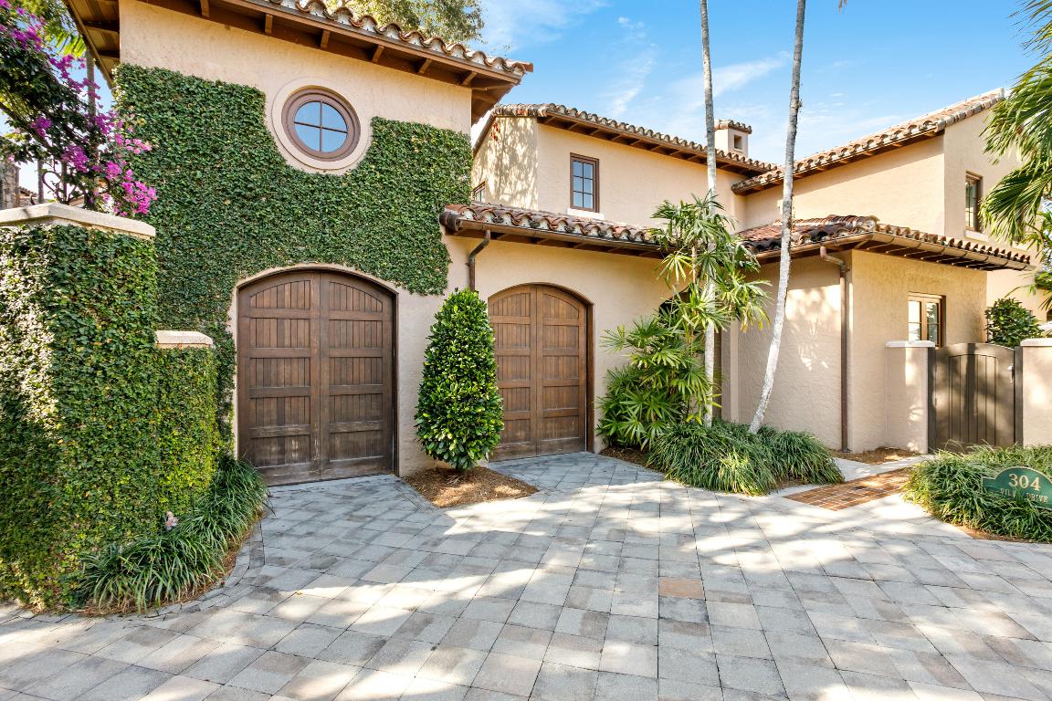 Perfectly positioned on the 18th hole in The Bear's Club, this 4-bedroom, 4.1-bath golf villa meets effortless luxury living. Completely reimagined by a premier Palm Beach County builder and offered fully furnished with exquisite designer interiors by Pineapples & Palms of Jupiter. Sun-filled spaces feature custom cabinetry, Wolf and Subzero appliances, Waterworks fixtures, Dolomite marble in the spa-like primary bath, tongue-and-groove ceilings, shiplap walls, Starke carpets, and curated designer wallpaper throughout. Every bath has been thoughtfully redesigned with elegant details. Step outside to your private pool overlooking manicured fairway and lake views—an elegant, turnkey villa in one of Jupiter's most exclusive communities.