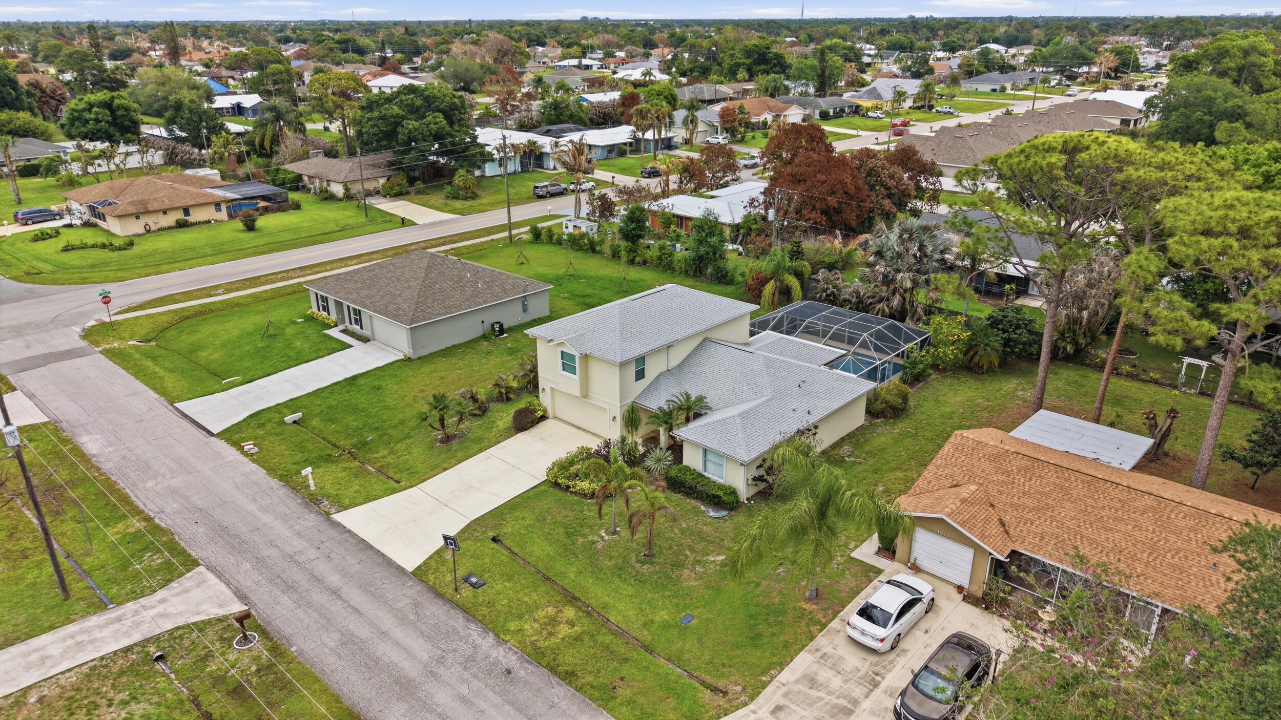 Welcome to this beautifully maintained 3-bedroom, 3-bathroom home in Port St. Lucie, Florida! This inviting residence offers a spacious, versatile layout perfect for comfortable living and entertaining. The kitchen features stainless steel appliances and granite countertops, flowing seamlessly into the main living areas. Upstairs, enjoy a private master suite and a large den ideal for a home office or media room.(Downstairs bedroom can be master suite as well) Step outside to your tropical retreat with a heated saltwater pool and mature fruit trees—perfect for relaxing or hosting. A new 2024 roof adds peace of mind. Brand New Pool Pump 2026. Conveniently located near parks and local amenities, this home blends comfort, lifestyle, and location. ! VIRTUALLY STAGED !