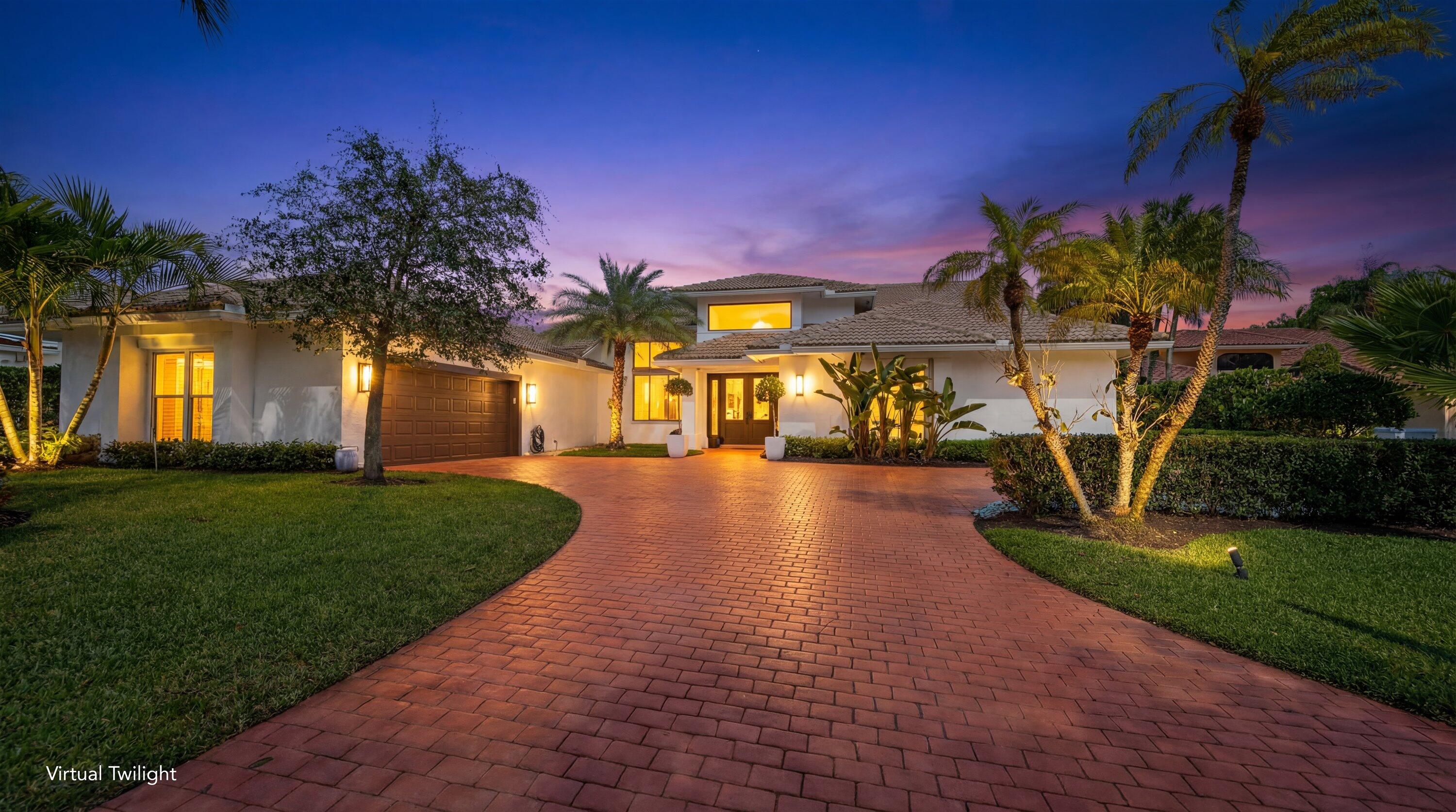 Located in the desirable Isle Brook neighborhood of Palm Beach Polo, this beautifully reimagined waterfront residence offers refined modern living with exceptional privacy. Featuring 4 bedrooms and 5 full bathrooms, the home is offered furnished and move-in ready.

Soaring vaulted ceilings, skylights, and expansive windows fill the interiors with natural light, complementing the crisp neutral palette and sophisticated finishes throughout. The home has been upgraded with wood flooring, adding warmth and continuity to the open-concept design. The layout flows seamlessly into a well-appointed chef's kitchen with quartz countertops, custom cabinetry, a center island, and professional-grade stainless steel appliances. The spacious primary suite provides a tranquil retreat with a spa-inspired bath, while each additional bedroom offers its own beautifully finished en-suite bathroom.

Outdoors, a travertine pool deck surrounds the pool and spa, creating an elegant setting to relax and enjoy serene lake views and lush tropical landscaping. A covered patio enhances the home's seamless indoor-outdoor lifestyle.

Additional features include impact windows and doors, a whole-home generator with underground propane, and a two-car garage.