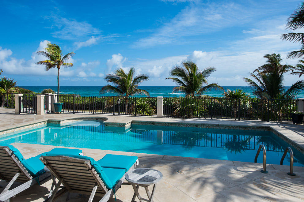 Amazing, panoramic ocean views from this 8 BR/8.5 BA home with 101’of frontage and an elevated pool overlooking the ocean. Two spacious levels include oceanfront family room with wet bar, separate guest quarters with its own kitchen, laundry, & family/game room. Detailed moldings, Brazilian cherry wood and marble floors, kitchen with granite countertops, & top of the line appliances.