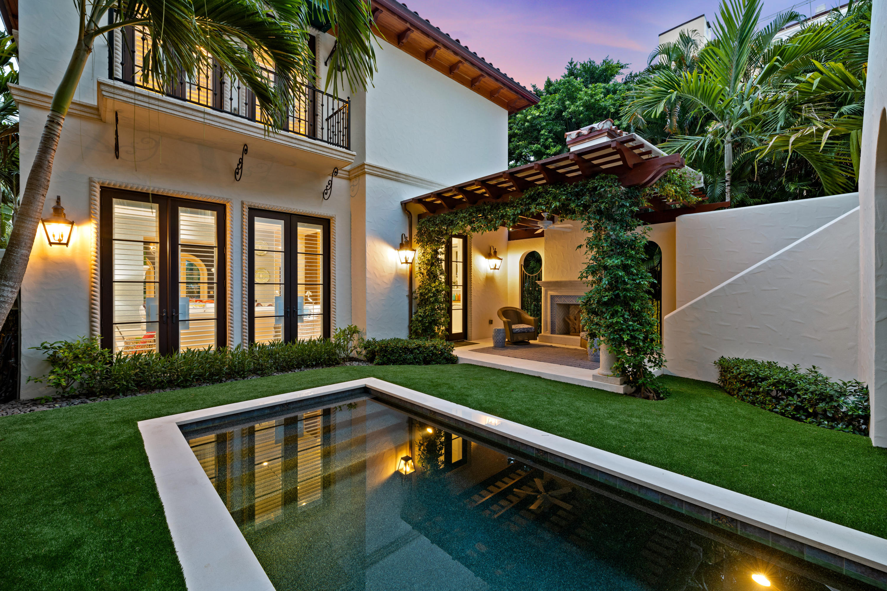 Chic 2016 - Patrick Segraves, SKA Architect + Planner - jewel that has been maintained in pristine condition and treated to an abundance of top tier designer upgrades in the past 18 months. Simply 'Best in Class' beginning with extraordinary 13' foot ceilings in the family/living rooms on the first floor, then upstairs or elevator to 10' ceilings in master suite overlooking the serene pool and guest house. Limestone floors greet the homeowner upon entry and continue on stairs with walnut hardwood flooring in the living room, family room, bedrooms and library. Kolbe windows/doors create light-filled rooms throughout that accentuate a vibrant color palette. The second floor has an ensuite guest room separated from the master suite by a paneled library. All baths have large format... ...stone flooring and walls with tasteful choices from paper to hardware to lighting. New whole-house generator.
 Relax and entertain in the lushly landscaped tropical pool setting with vertical garden wall and after sunset lighting.  Bougainvillea climbs a pergola shading a pleasant seating area and fireplace poolside. A two car garage with ample storage has a private guest suite above, currently a fitness studio.
 Must be seen to be appreciated. 
 Located in the heart of downtown this remarkable home is only a short walk to restaurants, shops and hotels. Chilean Ave is just the second street north of world famous Worth Ave. The Intracoastal Waterway (Lake Worth) and the Palm Beach Marina (see site: https://townofpalmbeach.com/282/Town-Marina) may be seen from the second story. The Palm Beach Lake Trail begins just 400' from your front door and runs up the lake just over 4 miles for the best walk, ride or run on the island. Palm Beach's public and lifeguarded beach is just 3 blocks east.