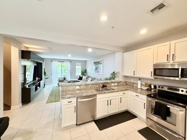 Live the ultimate South Florida lifestyle in this stunning Townhouse, perfectly situated in the heart of East Delray Beach. Just steps from the brand-new SUNDY VILLAGE- the hottest destination in town. Easy access to chic new restaurants and upscale shops . Inside you'll find an open-concept layout designed for entertaining, featuring a built-in bar, high ceilings and natural light. The spacious living area creates an inviting atmosphere for hosting guests or relaxing in style. On the third level you have 2 primary suites and the laundry room. Wake up with the view of Lush and tropical surroundings. An oversize 2 car garage and first floor office/den or easily converted to a 3rd bedroom with a bathroom. Coda is a gated community. The perfect place to have a golf cart and have some fun. Available August 1st, 2026