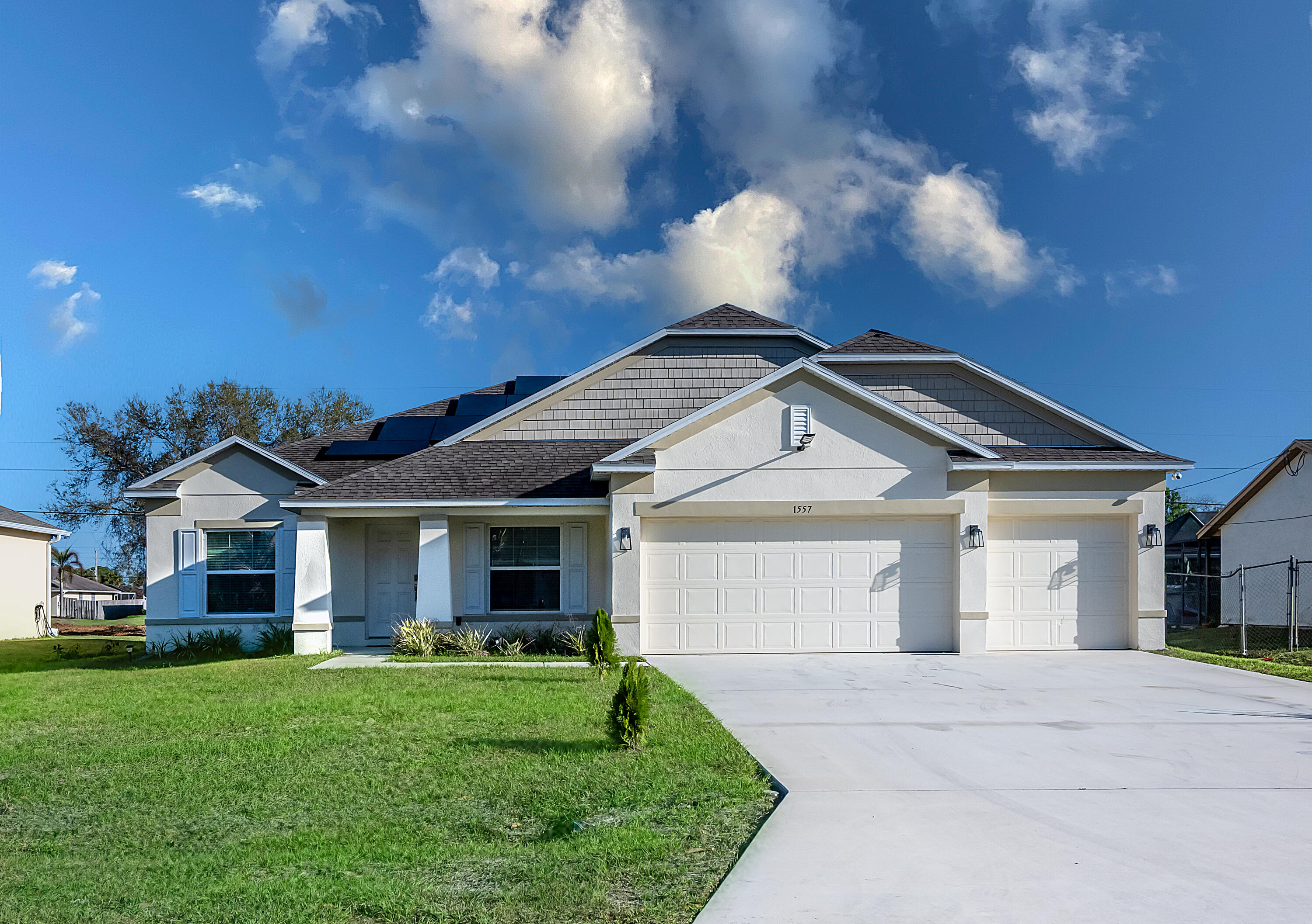 Beautiful Spacious 4 bedroom, 3 full baths, 3 Car Garage home built in 2022 by Maronda Homes- NO HOA. This home features a split floor plan with a Great Room, Formal Dining Room, Kitchen dining nook, Flex space to use as a Office or Den, Laundry room,  Granite Kitchen Counters, Stainless Steel Appliances and a Center Island.  You'll love the Recessed Lights and Remote Ceiling Fans. Tile throughout the home, no carpets. Smart Home with Alarm system. Front Porch and Screened in Lanai for entertaining. Partial screened in back yard.  Newly Installed Solar Panels (Feb 2026) Huge Master Suite with plenty of closet space, dual sinks in Master Bath, separate Tiled shower and Roman tub. Great location 10 minutes from the Heart of Tradition, stores, restaurants and entertaining. Off 1-95 Exit 118