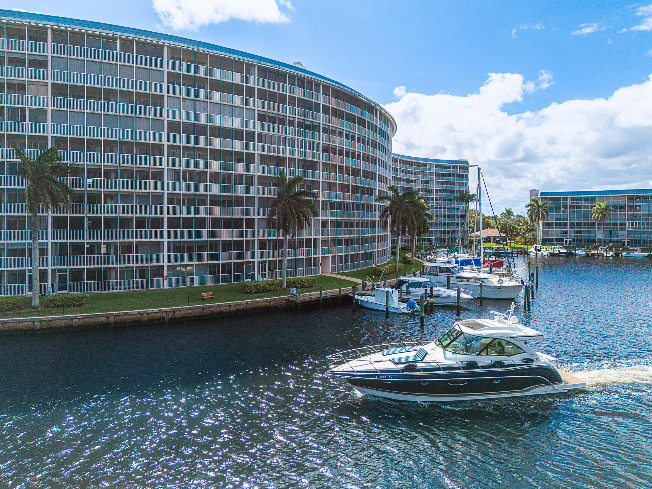 Enjoy breathtaking views of the Hillsboro River and natural preserve from this beautifully updated condo—arguably one of the best vantage points! Watch impressive mega yachts and boats coast by daily, with complete privacy. This residence features neutral tile, wood laminate bedroom flooring, a full-size washer and dryer and tankless hot water heater.  The community is well maintained, with all concrete restoration paid. Fiber direct into the condo with extremely high speed! Internet/TV and water included in HOA.  Boat slips (when avail) at less than $3 per foot.  Move in and experience waterfront living at its finest!