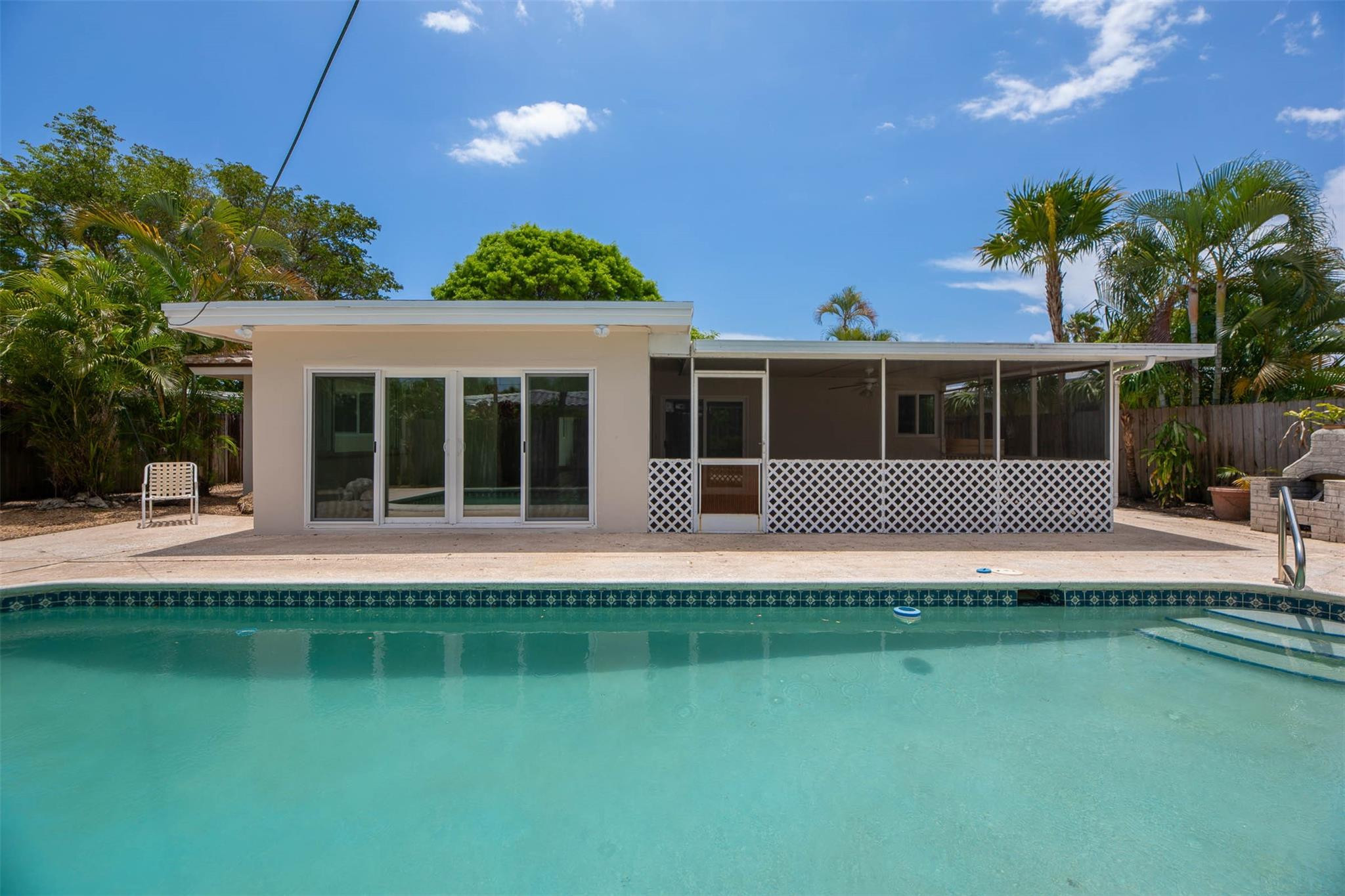 Live the South Florida lifestyle in this lovely 2-bedroom, 2-bath home just minutes from the beach, downtown Fort Lauderdale, and vibrant Wilton Drive in Wilton Manors. Enjoy an open floor plan, modern kitchen, spacious bedrooms, and a primary suite with en-suite bath. Step outside to your private pool and fenced backyard oasis, ideal for entertaining. The home also features a 1-car garage, central A/C, and in-home laundry. Located in a quiet, desirable neighborhood with easy access to shops, dining, and nightlife. Much of the original drain/sewer plumbing has already been upgraded to PVC.