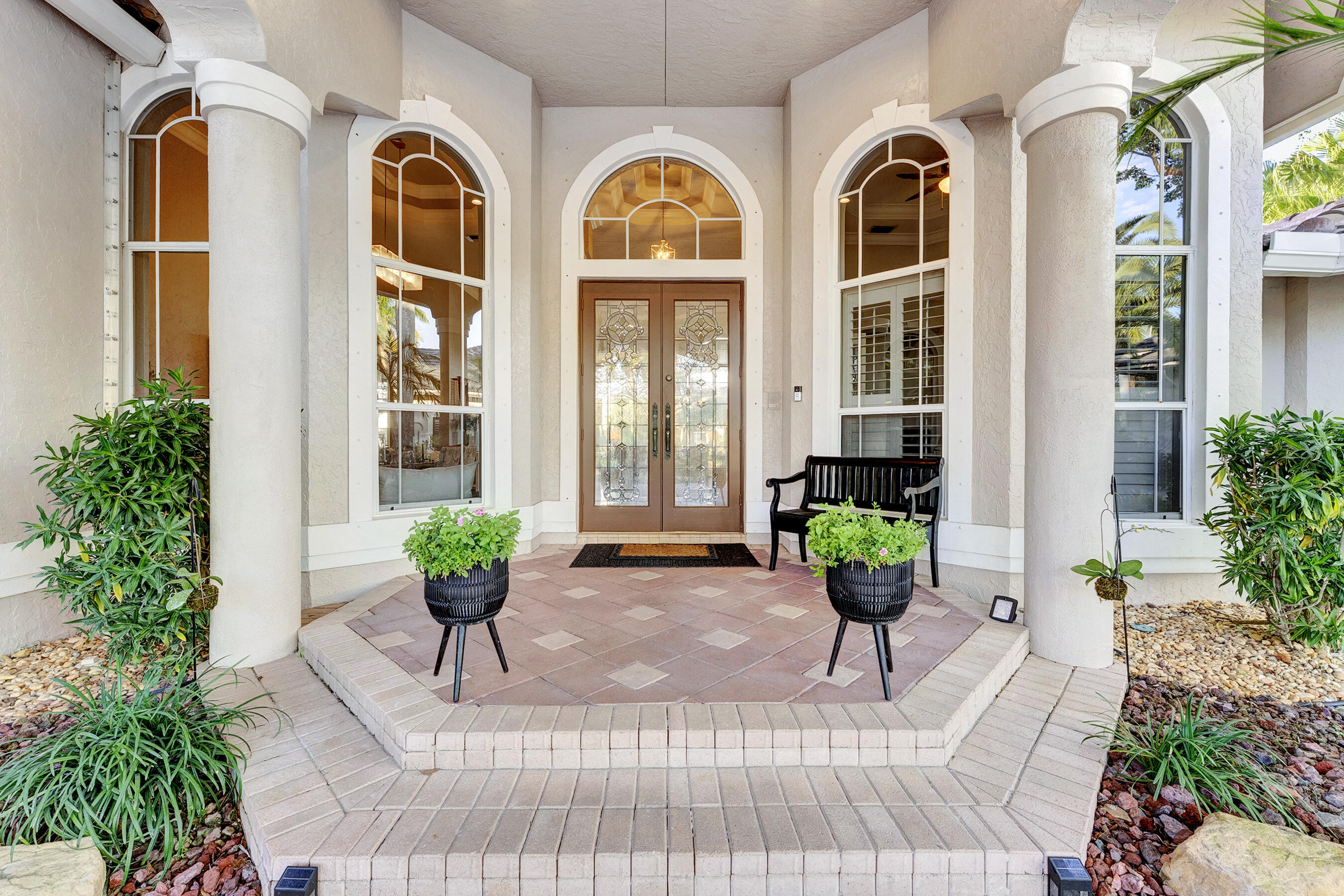 Discover unparalleled South Florida sophistication in this exquisite one-story custom residence nestled within the exclusive double-gated enclave of The Falls in the coveted Heron Bay community. Thoughtfully updated and meticulously maintained, this exceptional home offers the perfect blend of luxury, comfort, and privacy.  Step inside to expansive marble-floored living spaces, soaring ceilings, and an open-concept layout designed for both everyday living and elegant entertaining. The chef-inspired designer kitchen serves as the heart of the home, seamlessly connecting to spacious living and dining areas. The enhanced owner's suite provides a private retreat, complete with a beautifully renovated spa-style bathroom. Recent upgrades offer peace of mind, including a new roof (2022), two new 5-ton A/C systems (2023), and a fully upgraded pool system featuring new Diamond Brite finish, saltwater filtration, heater, and pumps (2023). Outdoors, enjoy your own resort-style oasis with breathtaking panoramic views overlooking a pristine 150-acre nature preserve—arguably one of the most spectacular views in Parkland and Coral Springs. The western exposure creates unforgettable sunset backdrops while ensuring exceptional privacy with no rear neighbors.  Located within one of Parkland's most sought-after communities, residents enjoy access to world-class amenities, including resort-style pools, fitness centers, tennis courts, clubhouse facilities, and top-rated Parkland schools. This residence offers an extraordinary lifestyle opportunity for the most discerning buyer seeking luxury, tranquility, and unmatched natural beauty.
