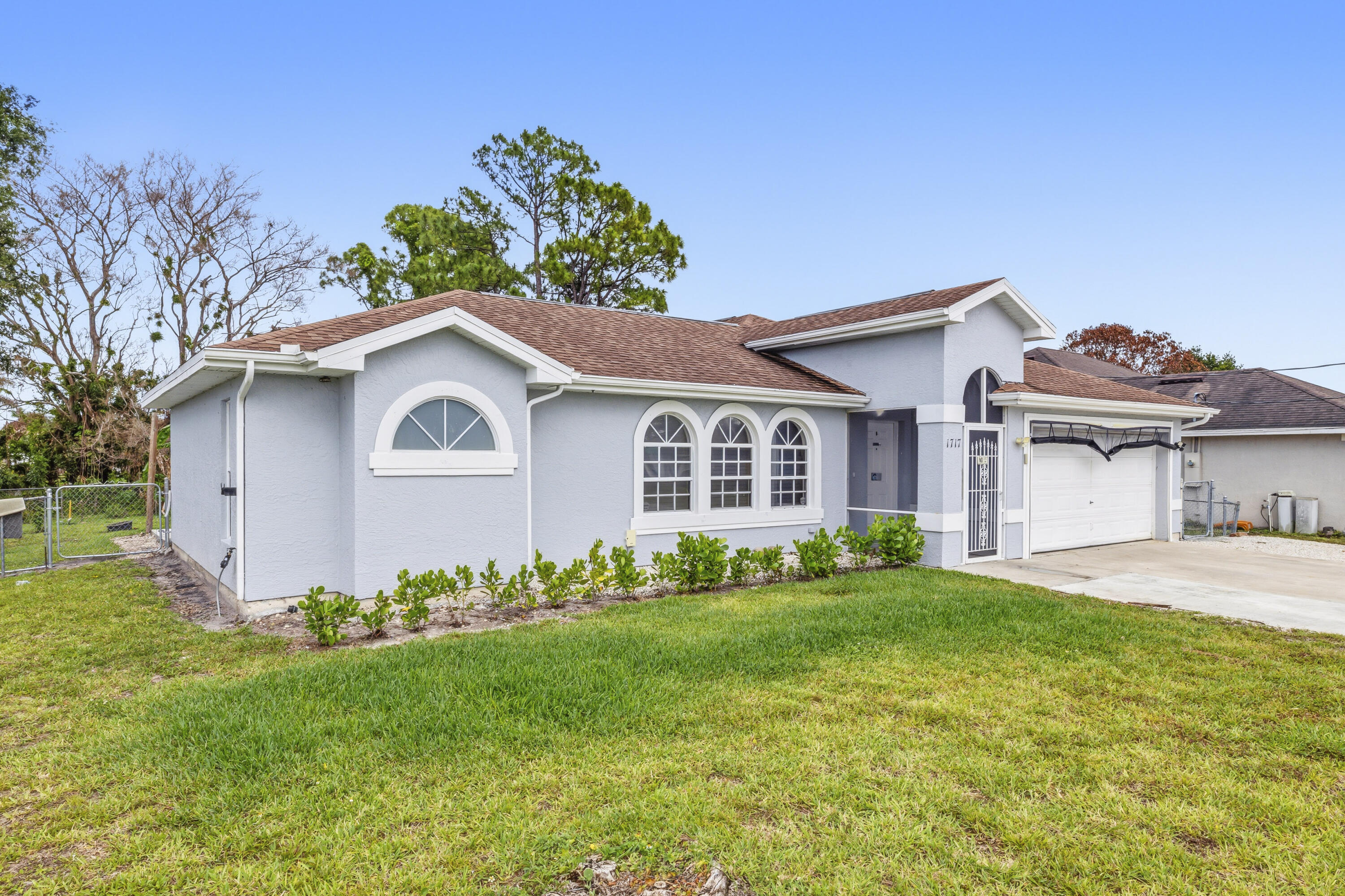 Beautifully updated home with an open-concept layout and a completely renovated kitchen featuring all stainless steel appliances. Enjoy luxury vinyl flooring throughout and a versatile den/office that can easily serve as a 4th bedroom. The enclosed, screened patio is perfect for relaxing or entertaining, overlooking a spacious fenced backyard filled with fruit trees. The fully concreted exterior offers ample parking for up to 6 vehicles. A move-in ready property with comfort, style, and plenty of space inside and out.
