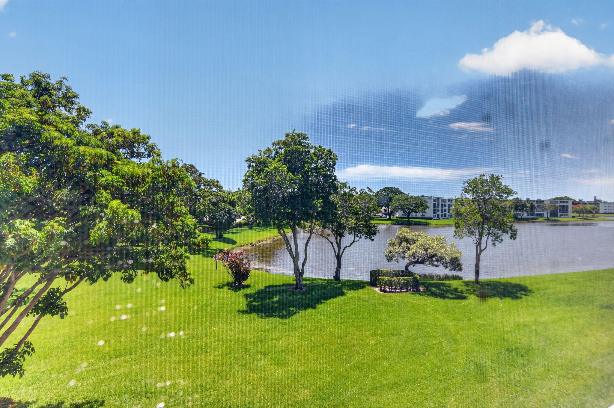 Welcome to this 1-bedroom, 1.5-bath waterfront condo in Wolverton at Century Village Boca Raton. Offered partially furnished or unfurnished, this unit presents a great opportunity to update and personalize to your taste. Enjoy peaceful water views from the enclosed lanai—perfect for morning coffee or evening relaxation. Conveniently located near the laundry room, storage area, elevator, and satellite pool. Just a short walk to the clubhouse, where you'll enjoy resort-style amenities including indoor and outdoor pools, a fitness center, pickleball, tennis, theater, courtesy bus service, and an abundance of clubs, classes, and social activities.